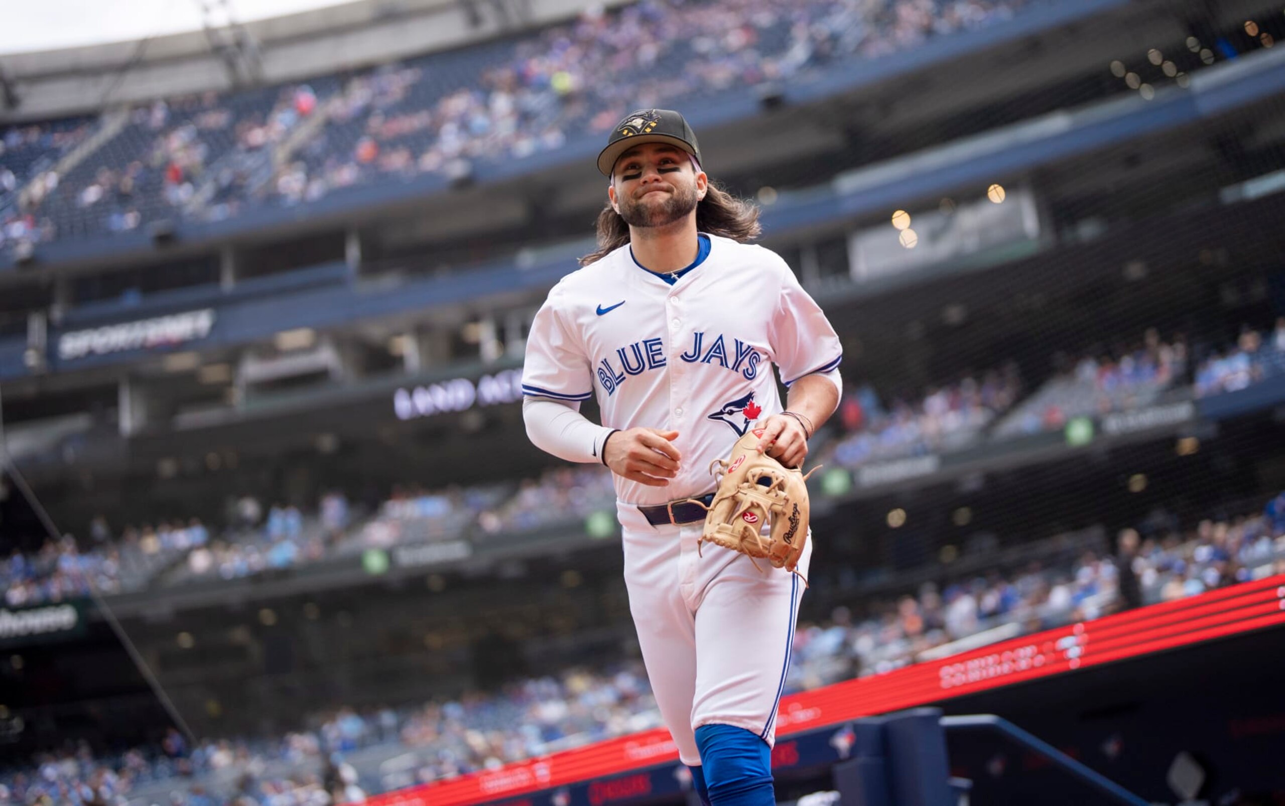 TORONTO, ON - MAY 18: Bo Bichette #11 of Toronto Blue Jays takes the field to warm up ahead of playing the Tampa Bay Rays in their MLB game at the Rogers Centre on May 18, 2024 in Toronto, Ontario, Canada. (Photo by Mark Blinch/Getty Images)