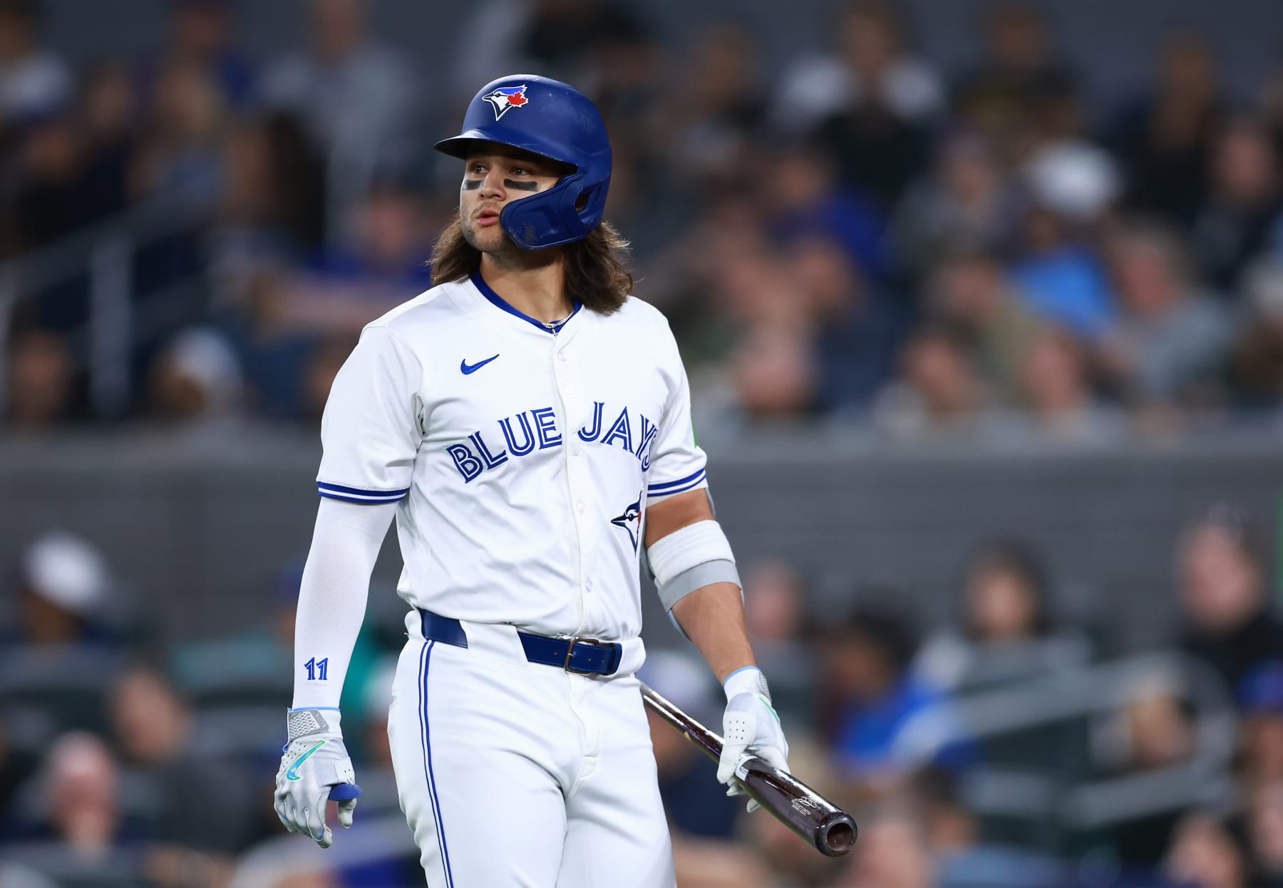 TORONTO, ON - MAY 10:  Bo Bichette #11 of the Toronto Blue Jays returns to the dugout after striking out during a game against the Minnesota Twins at Rogers Centre on May 10, 2024 in Toronto, Ontario, Canada.  (Photo by Vaughn Ridley/Getty Images)