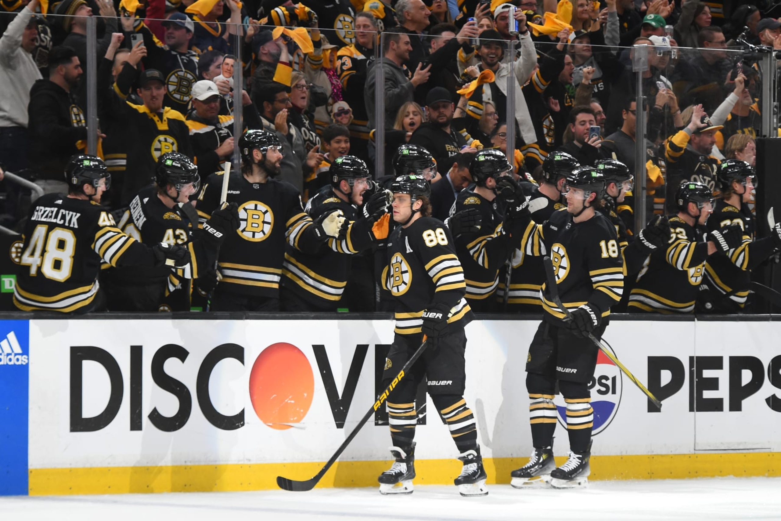 BOSTON, MASSACHUSETTS - APRIL 22: David Pastrnak #88 and Pavel Zacha #18 of the Boston Bruins celebrate the first-period goal against the Toronto Maple Leafs in Game Two of the First Round of the 2024 Stanley Cup Playoffs at the TD Garden on April 22, 2024 in Boston, Massachusetts. (Photo by Steve Babineau/NHLI via Getty Images)