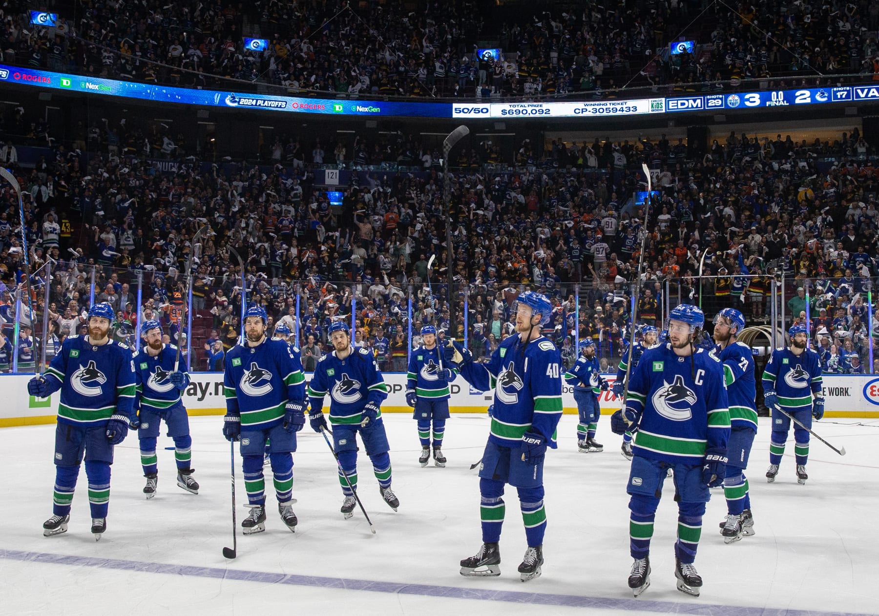 VANCOUVER, CANADA - MAY 20: The Vancouver Canucks wave in appreciation to fans after Game Seven of the Second Round of the 2024 Stanley Cup Playoffs loss against the Edmonton Oilers at Rogers Arena on May 20, 2024 in Vancouver, British Columbia, Canada. Edmonton won 3-2 (Photo by Jeff Vinnick/NHLI via Getty Images)