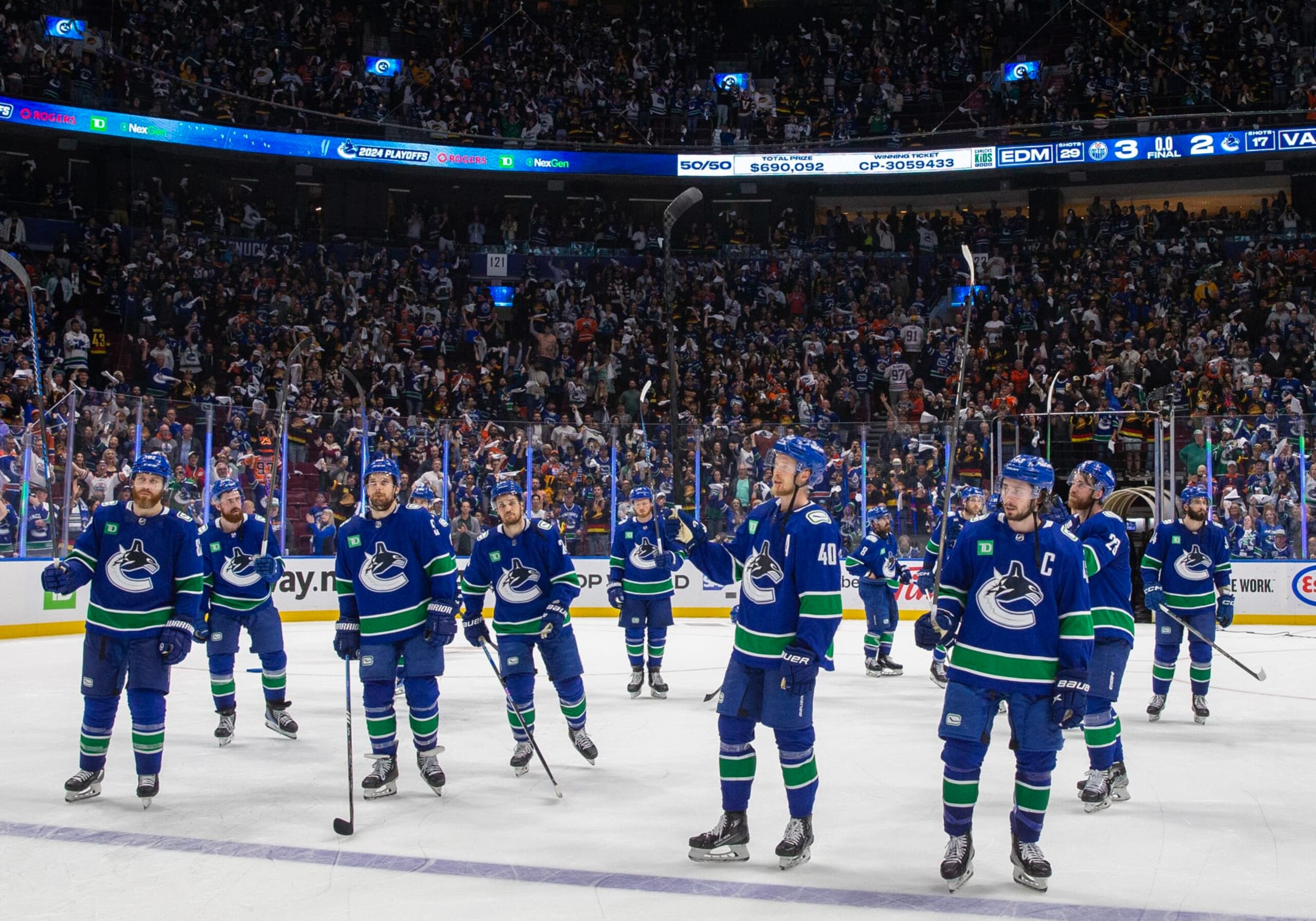VANCOUVER, CANADA - MAY 20: The Vancouver Canucks wave in appreciation to fans after Game Seven of the Second Round of the 2024 Stanley Cup Playoffs loss against the Edmonton Oilers at Rogers Arena on May 20, 2024 in Vancouver, British Columbia, Canada. Edmonton won 3-2 (Photo by Jeff Vinnick/NHLI via Getty Images)