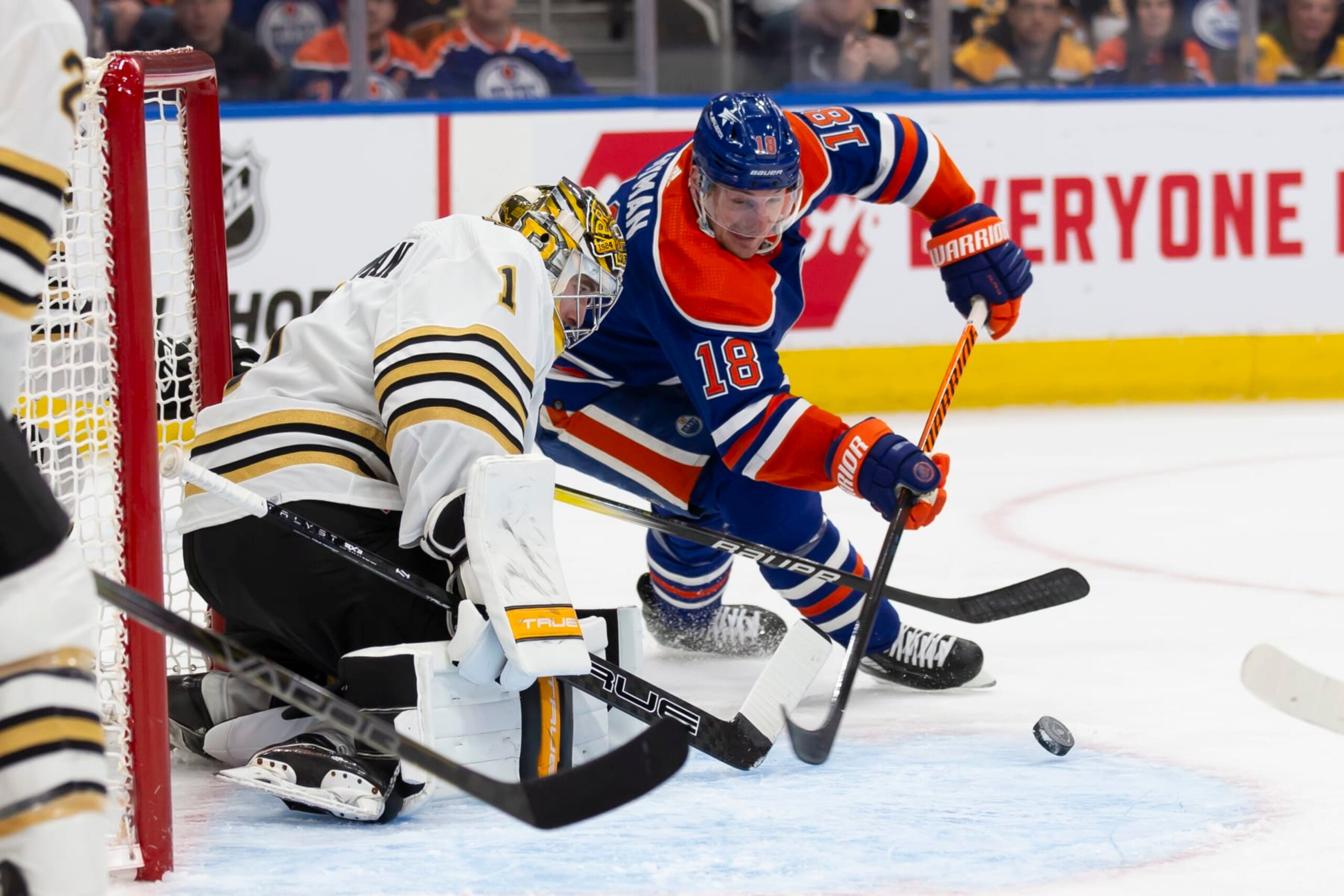 EDMONTON, CANADA - FEBRUARY 21: Zach Hyman #18 of the Edmonton Oilers goes for a wraparound against goaltender Jeremy Swayman #1 of the Boston Bruins during the second period at Rogers Place on February 21, 2024 in Edmonton, Canada. (Photo by Codie McLachlan/Getty Images)