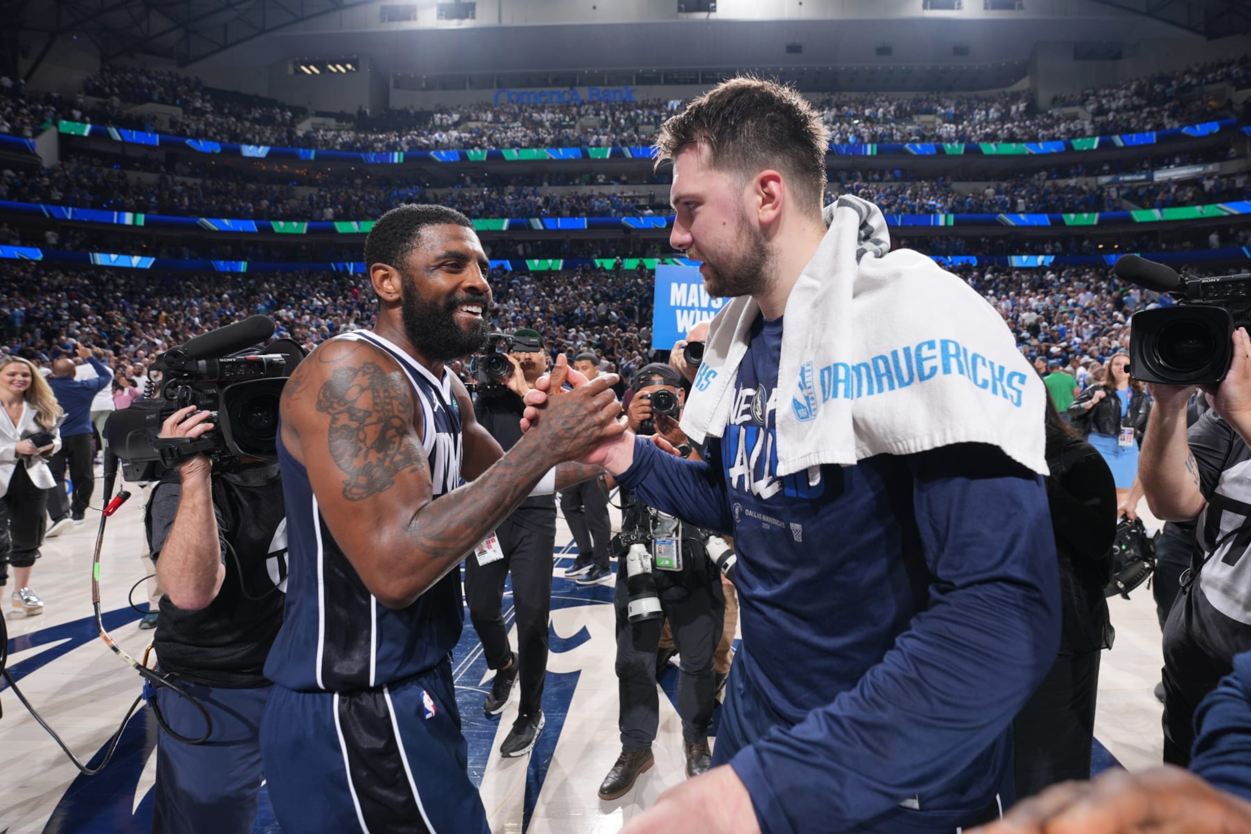 DALLAS, TX - MAY 26: Kyrie Irving #11 and Luka Doncic #77 of the Dallas Mavericks high five during the game against the Minnesota Timberwolves during Game 3 of the Western Conference Finals of the 2024 NBA Playoffs on May 26, 2024 at the American Airlines Center in Dallas, Texas. NOTE TO USER: User expressly acknowledges and agrees that, by downloading and or using this photograph, User is consenting to the terms and conditions of the Getty Images License Agreement. Mandatory Copyright Notice: Copyright 2024 NBAE (Photo by Jesse D. Garrabrant/NBAE via Getty Images)