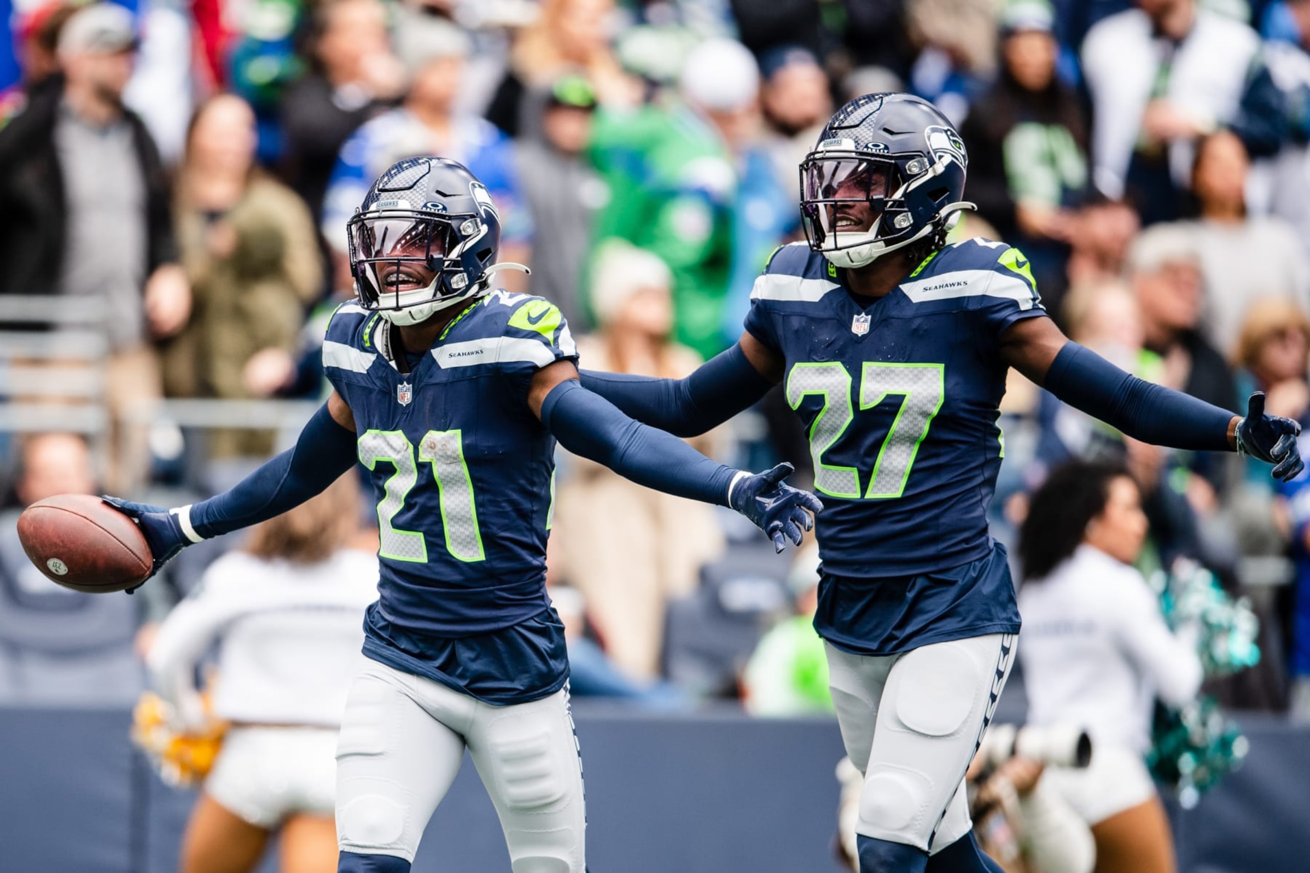 Seahawks CBs Devon Witherspoon (left) and Riq Woolen.