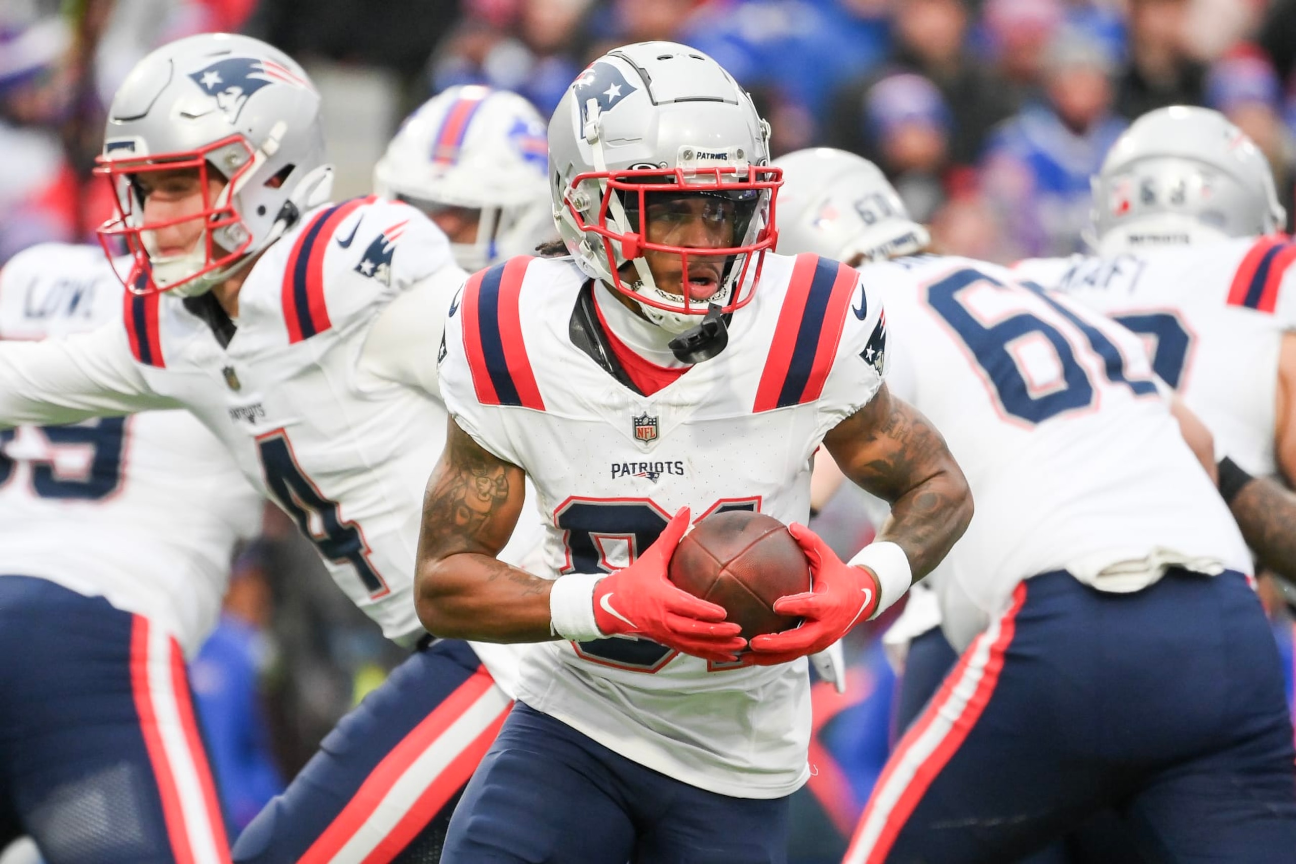 ORCHARD PARK, NEW YORK - DECEMBER 31: DeMario Douglas #81 of the New England Patriots runs with the ball  during the second half of a game against the Buffalo Bills at Highmark Stadium on December 31, 2023 in Orchard Park, New York. (Photo by Rich Barnes/Getty Images)