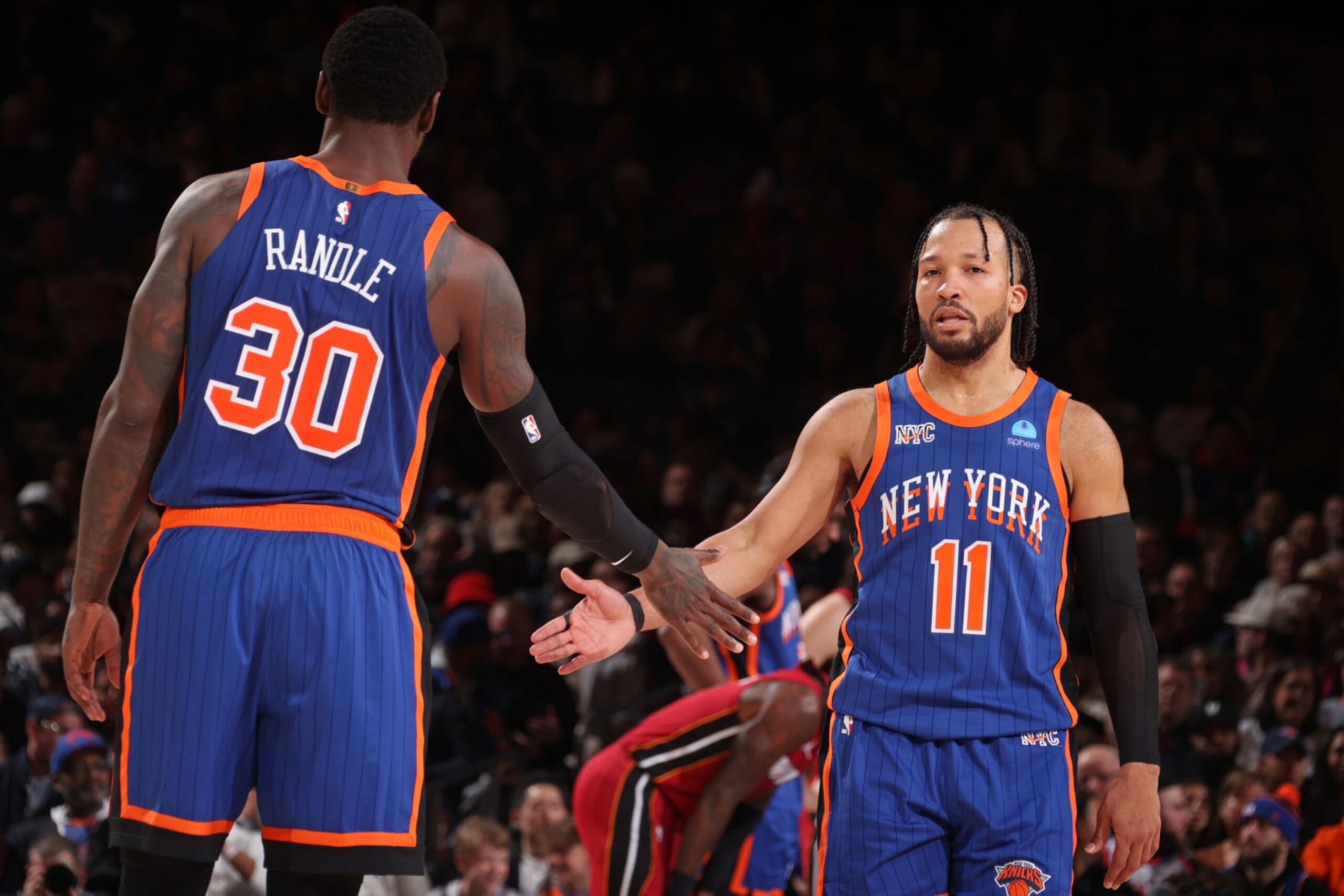 NEW YORK, NY - JANUARY 27: Jalen Brunson #11 and Julius Randle #30 of the New York Knicks high five during the game against the Miami Heat on January 27, 2024 at Madison Square Garden in New York City, New York.  NOTE TO USER: User expressly acknowledges and agrees that, by downloading and or using this photograph, User is consenting to the terms and conditions of the Getty Images License Agreement. Mandatory Copyright Notice: Copyright 2024 NBAE  (Photo by Nathaniel S. Butler/NBAE via Getty Images)