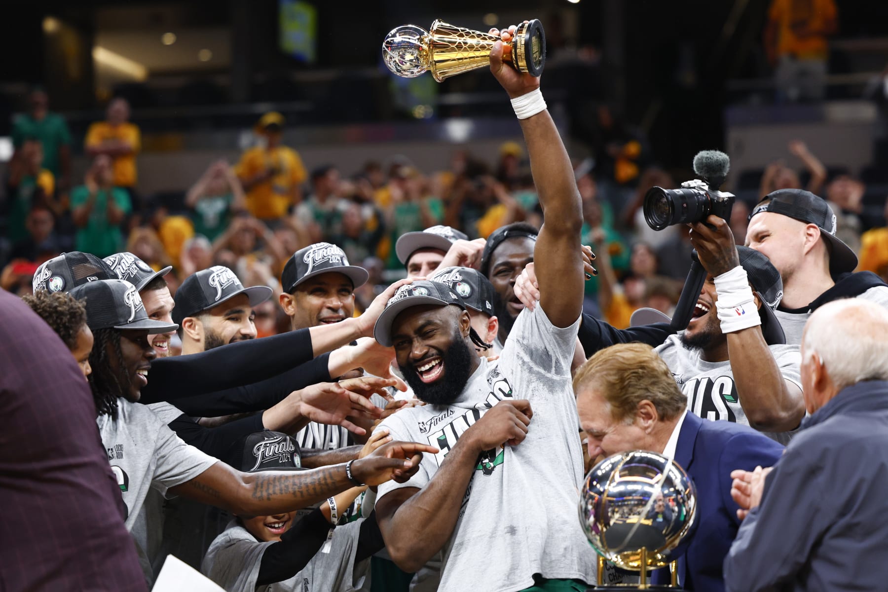 Indianapolis, IN - May 27: Boston Celtics guard Jaylen Brown holds up the Larry Bird trophy after being named 2024 Eastern Conference Finals MVP. (Photo by Danielle Parhizkaran/The Boston Globe via Getty Images)