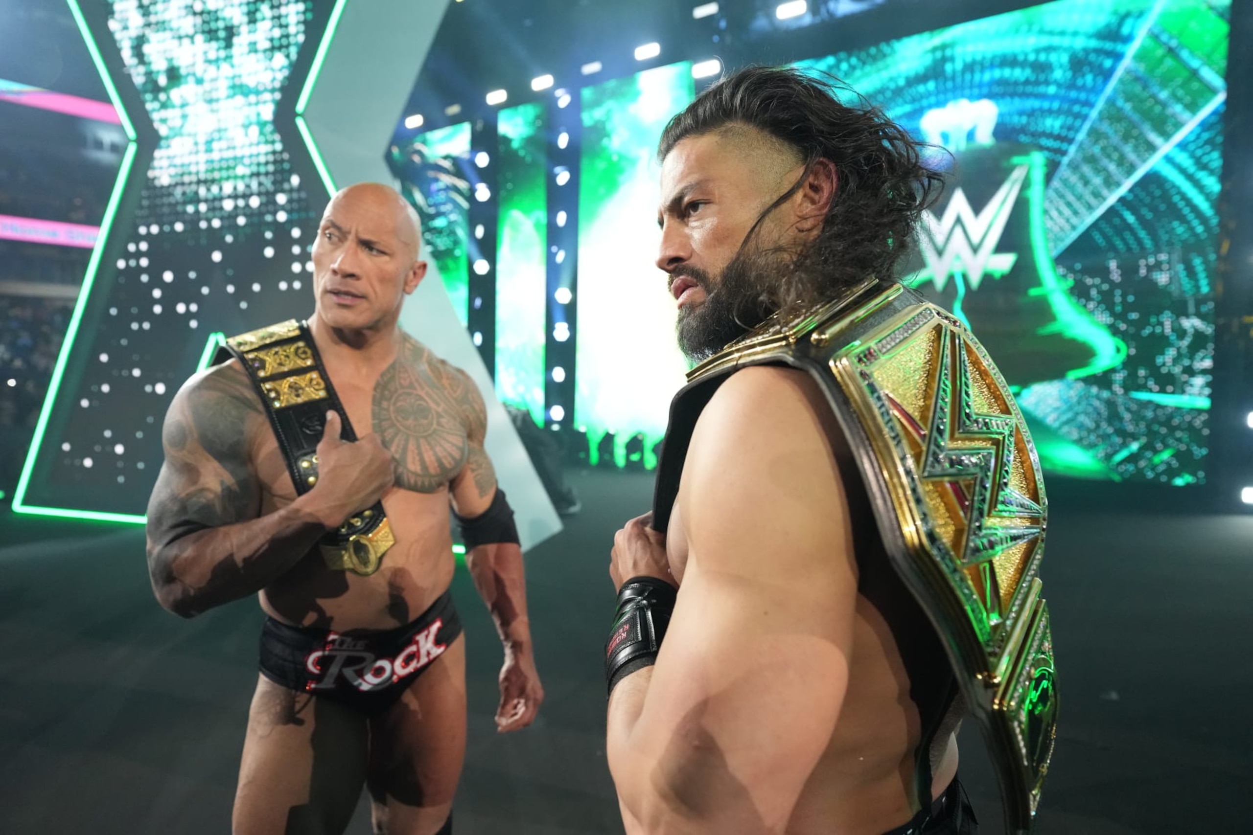 PHILADELPHIA, PENNSYLVANIA - APRIL 6: The Rock and Roman Reigns looking back at the ring after winning against Cody Rhodes and Seth Freakin Rollins at WrestleMania 40 at Lincoln Financial Field on April 6, 2024 in Philadelphia, Pennsylvania. (Photo by WWE/Getty Images)