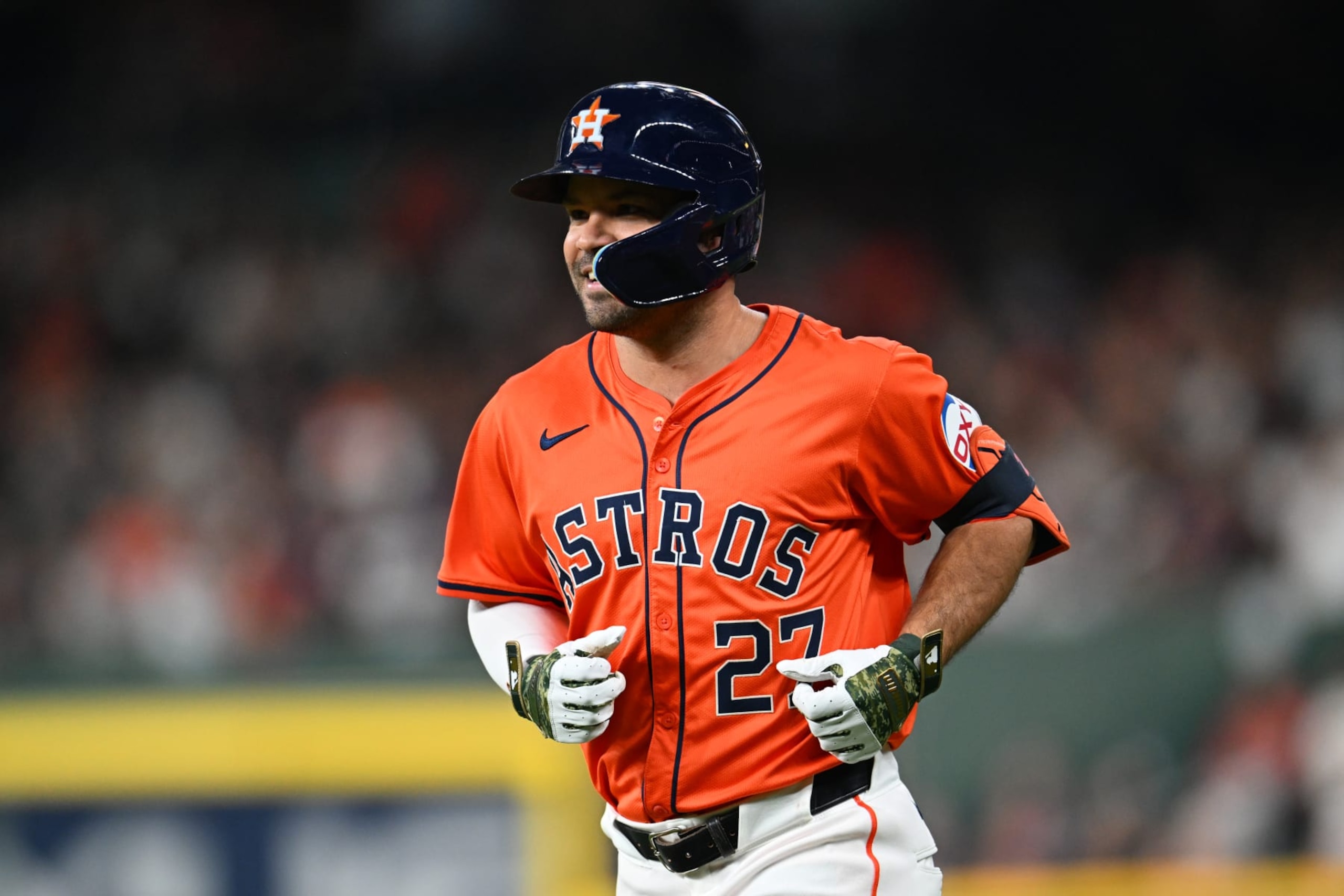 HOUSTON, TEXAS - MAY 17: Jose Altuve #27 of the Houston Astros runs against the Milwaukee Brewers at Minute Maid Park on May 17, 2024 in Houston, Texas. (Photo by Jack Gorman/Getty Images)