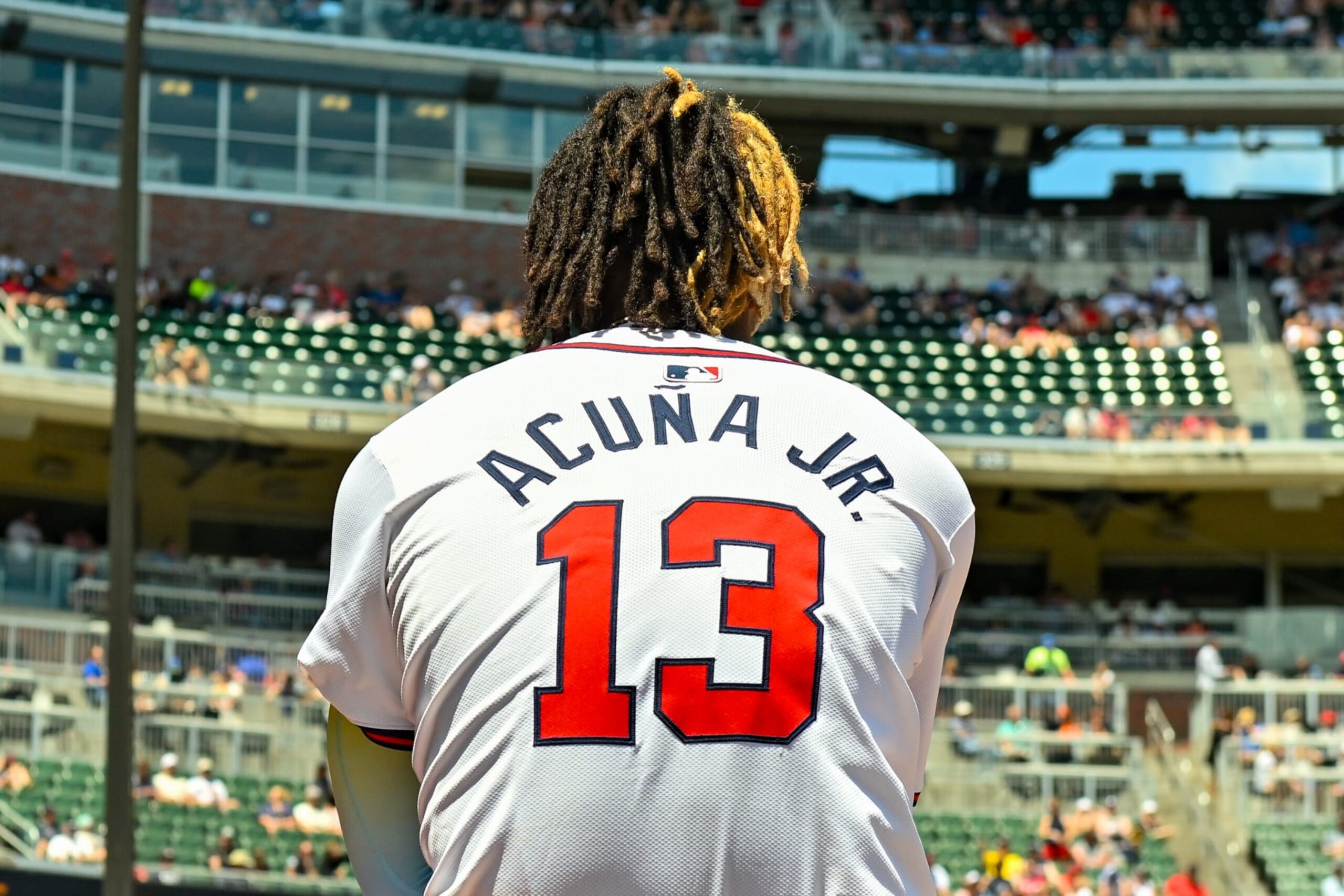 ATLANTA, GA  MAY 20:  Atlanta outfielder Ronald Acuña Jr. (13) in the dugout during the first game of a MLB doubleheader between the San Diego Padres and the Atlanta Braves on May 20th, 2024 at Truist Park in Atlanta, GA. (Photo by Rich von Biberstein/Icon Sportswire via Getty Images)
