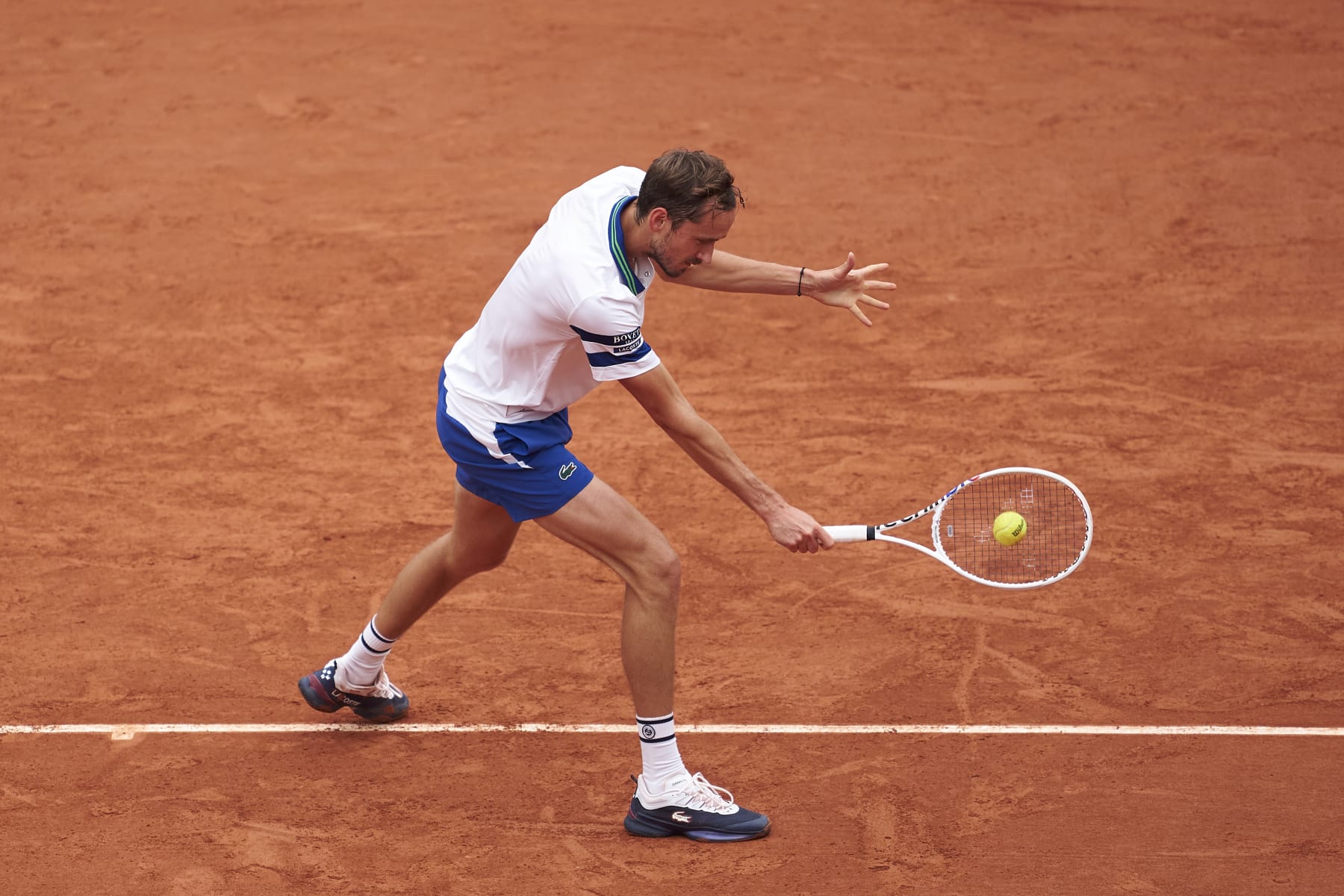 PARIS, FRANCE - MAY 30:  Daniil Medvedev plays a backhand against Miomir Kecmanovic of Serbia in the Men's Singles second round match on Day Five of the 2024 French Open at at Roland Garros on May 30, 2024 in Paris, France. (Photo by Mateo Villalba/Getty Images)
