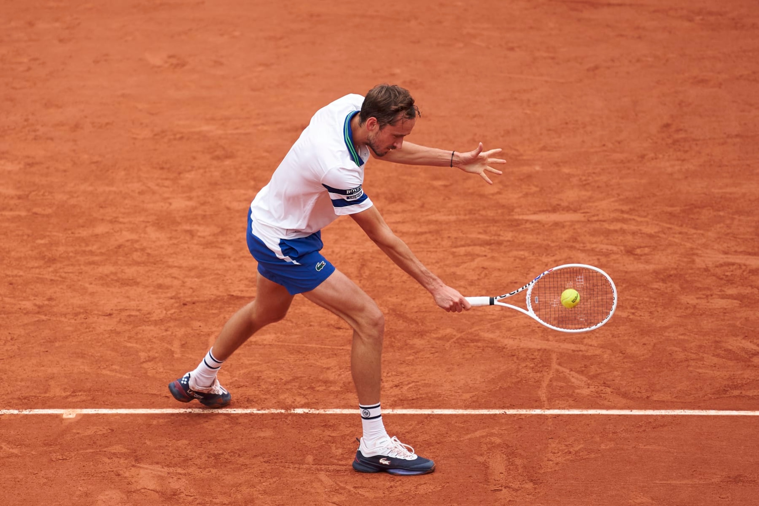 PARIS, FRANCE - MAY 30:  Daniil Medvedev plays a backhand against Miomir Kecmanovic of Serbia in the Men's Singles second round match on Day Five of the 2024 French Open at at Roland Garros on May 30, 2024 in Paris, France. (Photo by Mateo Villalba/Getty Images)