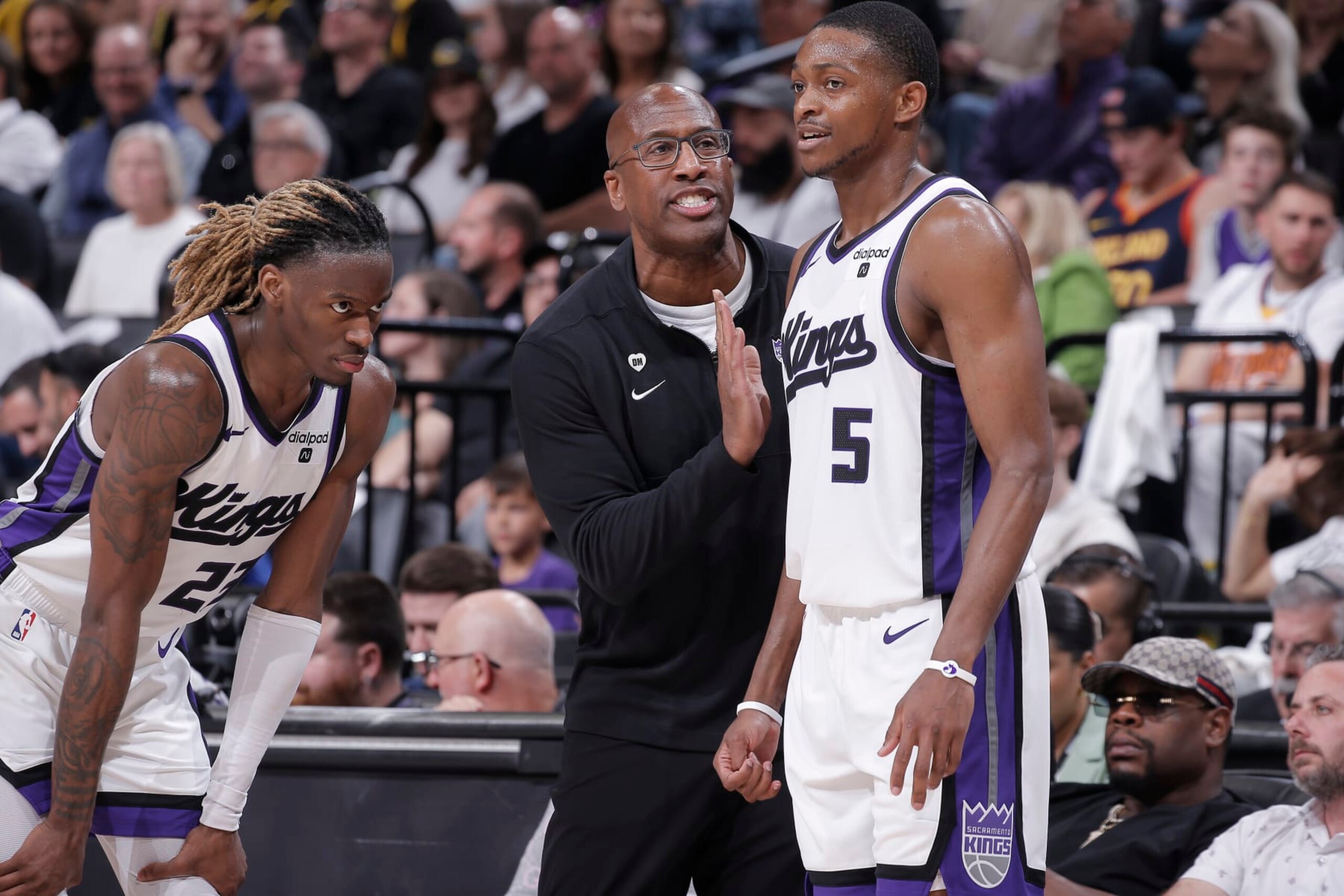 SACRAMENTO, CA - APRIL 16: Head Coach Mike Brown of the Sacramento Kings coaches De'Aaron Fox #5 and Keon Ellis #23 during the game against the Golden State Warriors during the 2024 Play-In Tournament on April 16, 2024 at Golden 1 Center in Sacramento, California. NOTE TO USER: User expressly acknowledges and agrees that, by downloading and or using this photograph, User is consenting to the terms and conditions of the Getty Images Agreement. Mandatory Copyright Notice: Copyright 2024 NBAE (Photo by Rocky Widner/NBAE via Getty Images)