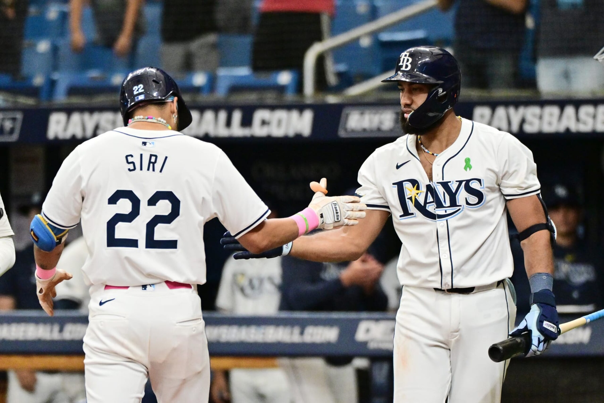 ST PETERSBURG, FLORIDA - MAY 30: Jose Siri #22 of the Tampa Bay Rays celebrates with Amed Rosario #10 after hitting a home run in the ninth inning against the Oakland Athletics at Tropicana Field on May 30, 2024 in St Petersburg, Florida. (Photo by Julio Aguilar/Getty Images)