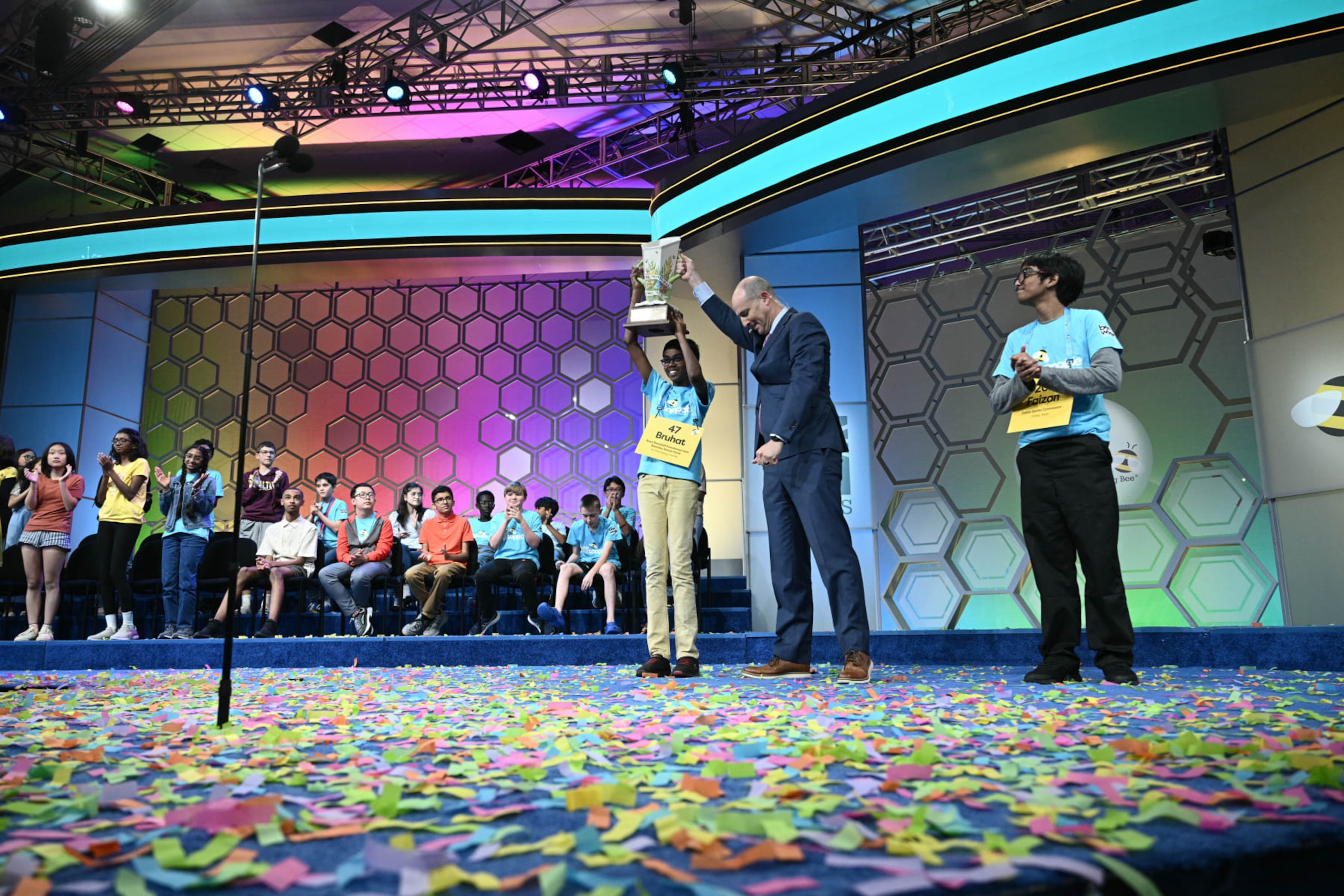 Bruhat Soma (L), of St. Petersburg, Florida, celebrates with the trophy after winning the 96th Scripps National Spelling Bee competition final round at the Gaylord National Resort and Convention Center, in National Harbor, Maryland on May 30, 2024. (Photo by Brendan SMIALOWSKI / AFP) (Photo by BRENDAN SMIALOWSKI/AFP via Getty Images)