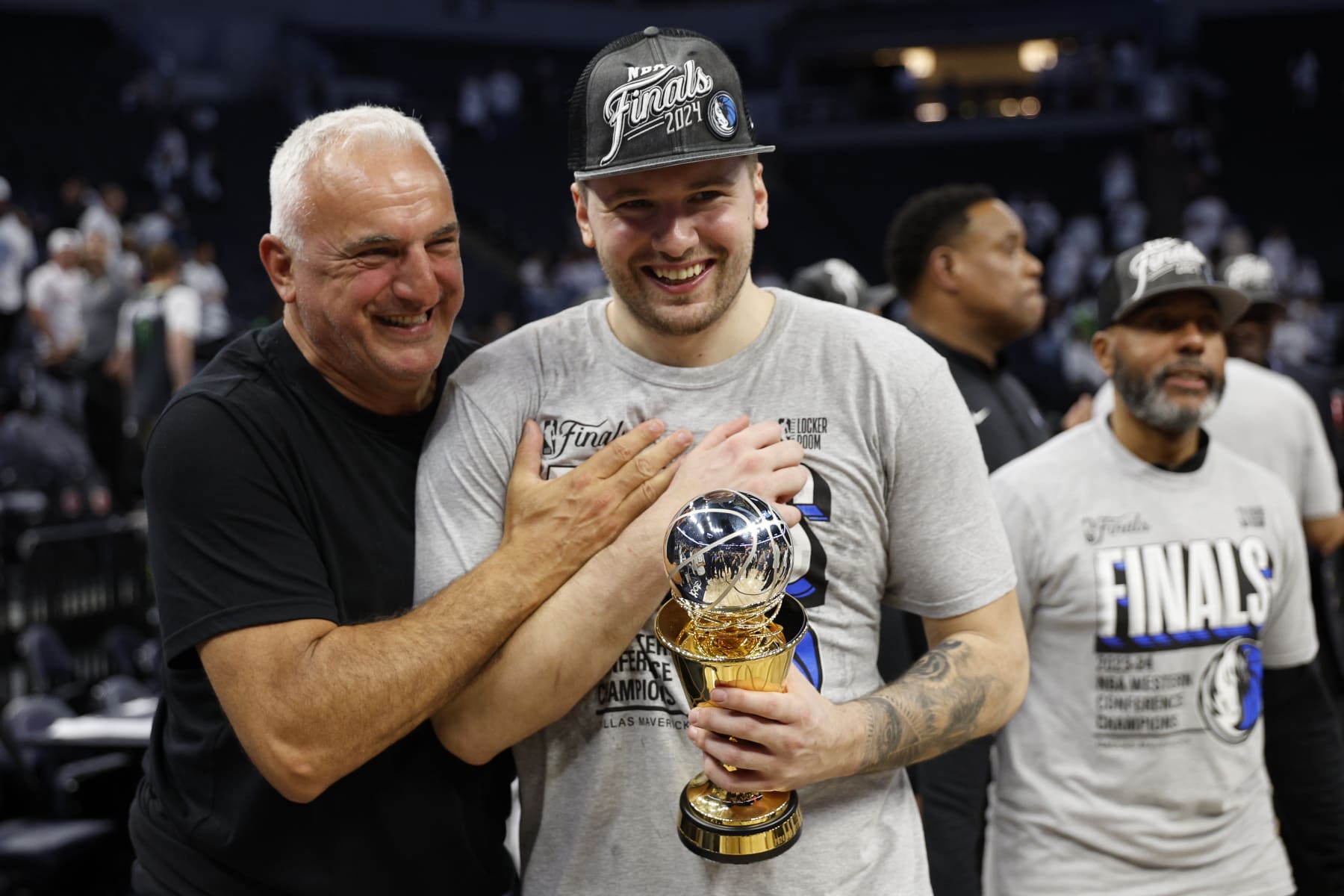 MINNEAPOLIS, MINNESOTA - MAY 30: Luka Doncic #77 of the Dallas Mavericks celebrates with is father Sasa after a 124-103 victory against the Minnesota Timberwolves in Game Five of the Western Conference Finals at Target Center on May 30, 2024 in Minneapolis, Minnesota. NOTE TO USER: User expressly acknowledges and agrees that, by downloading and or using this photograph, User is consenting to the terms and conditions of the Getty Images License Agreement. (Photo by David Berding/Getty Images)