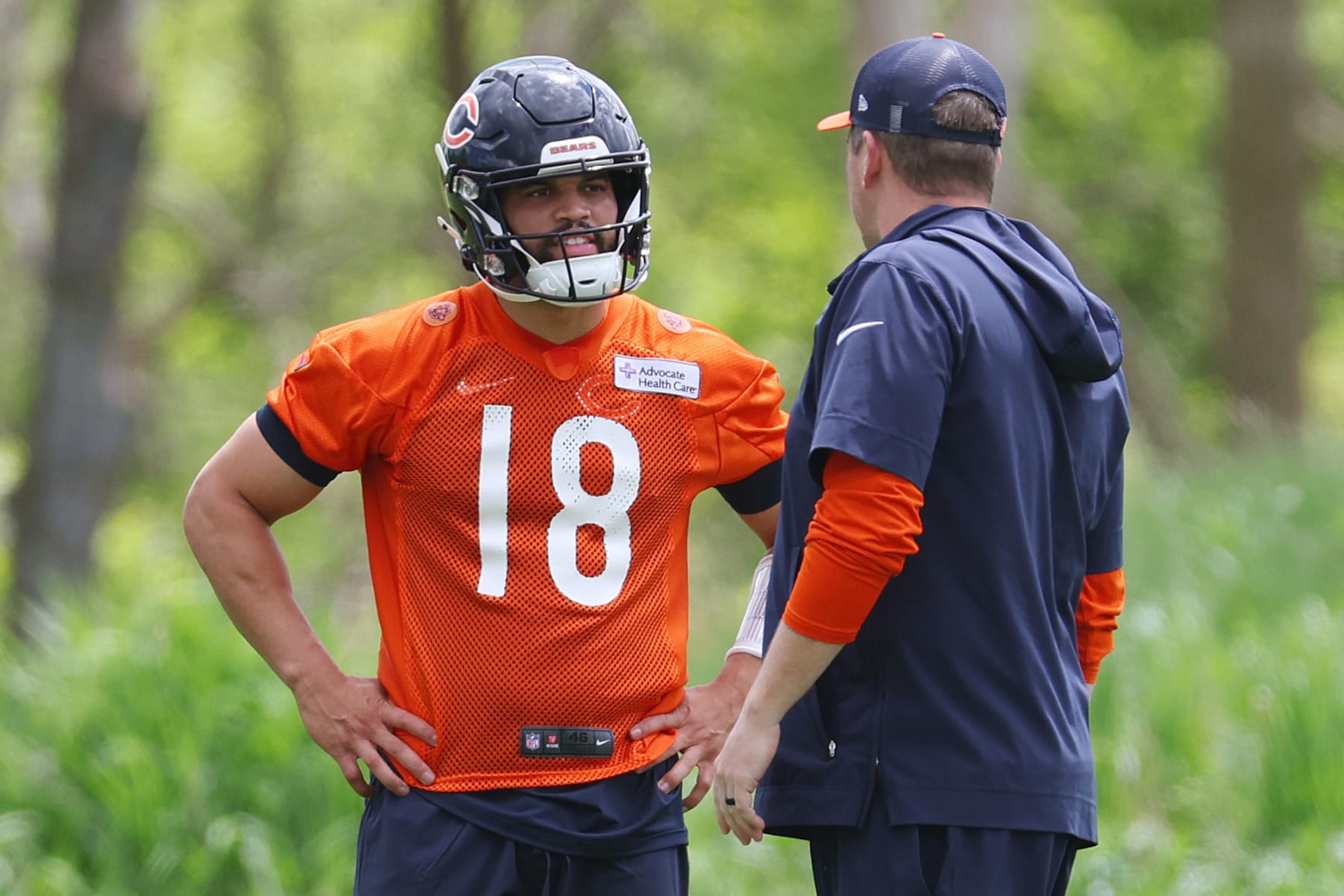 LAKE FOREST, ILLINOIS - MAY 10: Offensive coordinator Shane Waldron of the Chicago Bears talks with Caleb Williams #18 during Chicago Bears Rookie Minicamp at Halas Hall on May 10, 2024 in Lake Forest, Illinois.  (Photo by Michael Reaves/Getty Images)