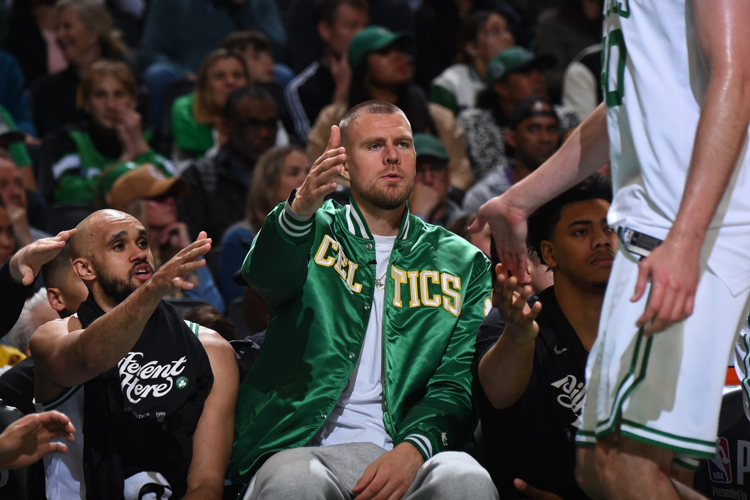 BOSTON, MA - MAY 9: Kristaps Porzingis #8 of the Boston Celtics high fives teammate during the game against the Cleveland Cavaliers during Round 2 Game 2 of the 2024 NBA Playoffs on May 9, 2024 at the TD Garden in Boston, Massachusetts. NOTE TO USER: User expressly acknowledges and agrees that, by downloading and or using this photograph, User is consenting to the terms and conditions of the Getty Images License Agreement. Mandatory Copyright Notice: Copyright 2024 NBAE  (Photo by Brian Babineau/NBAE via Getty Images)