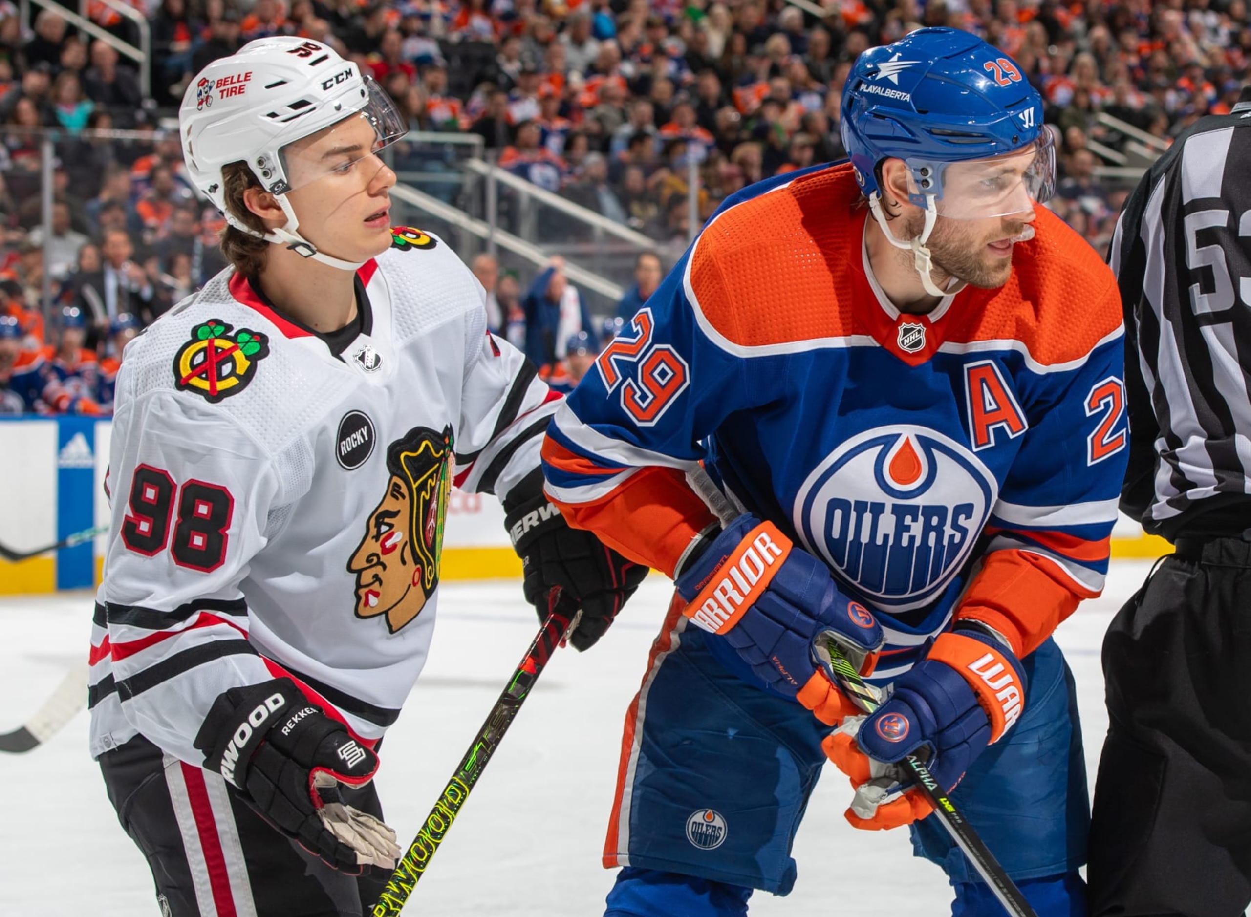 EDMONTON, CANADA - DECEMBER 12: Leon Draisaitl #29 of the Edmonton Oilers and Connor Bedard #98 of the Chicago Blackhawks track the puck after taking a face-off during the game at Rogers Place on December 12, 2023, in Edmonton, Alberta, Canada. (Photo by Andy Devlin/NHLI via Getty Images)