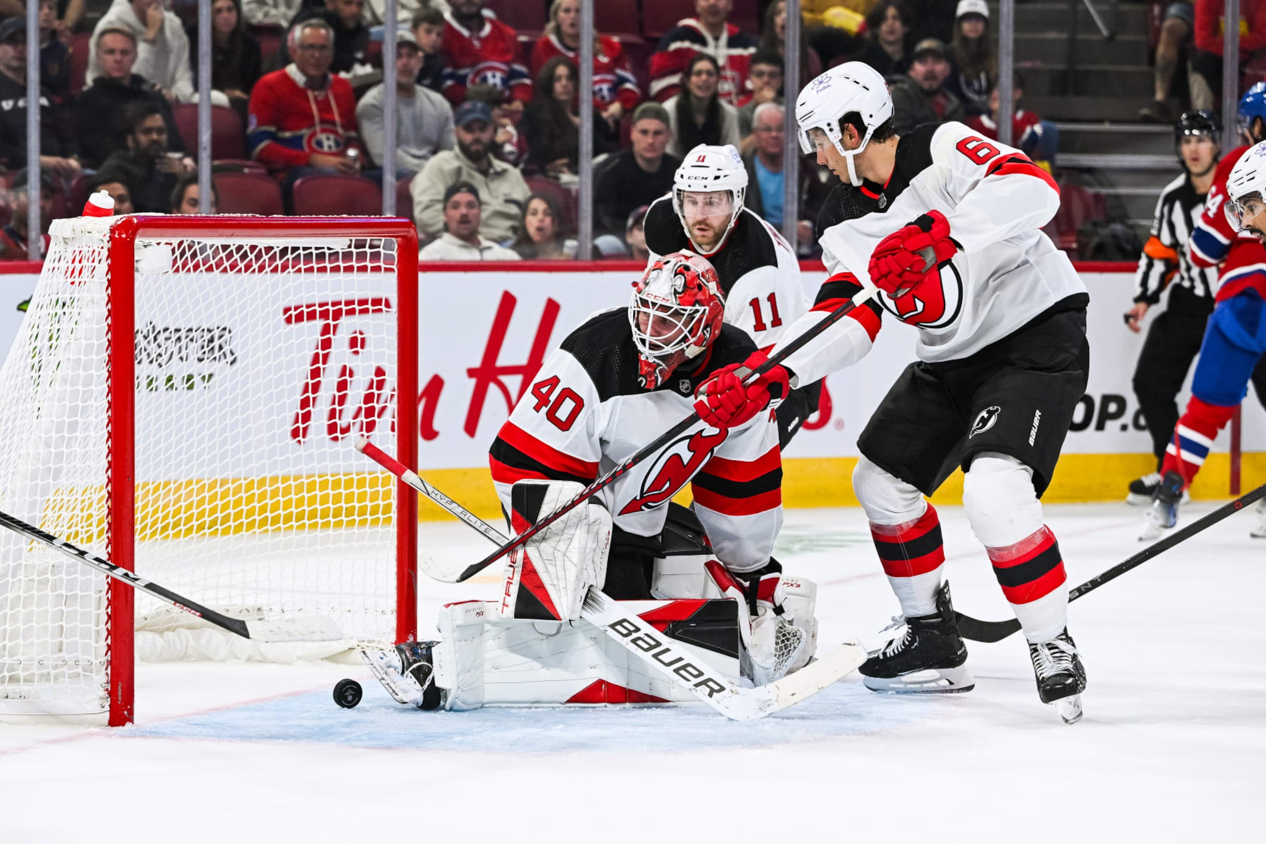 MONTREAL, QC - SEPTEMBER 25: New Jersey Devils goalie Akira Schmid (40) allows a goal to Montreal Canadiens right wing Josh Anderson (17) (not pictured) during the New Jersey Devils versus the Montreal Canadiens preseason game on September 25, 2023, at Bell Centre in Montreal, QC (Photo by David Kirouac/Icon Sportswire via Getty Images)