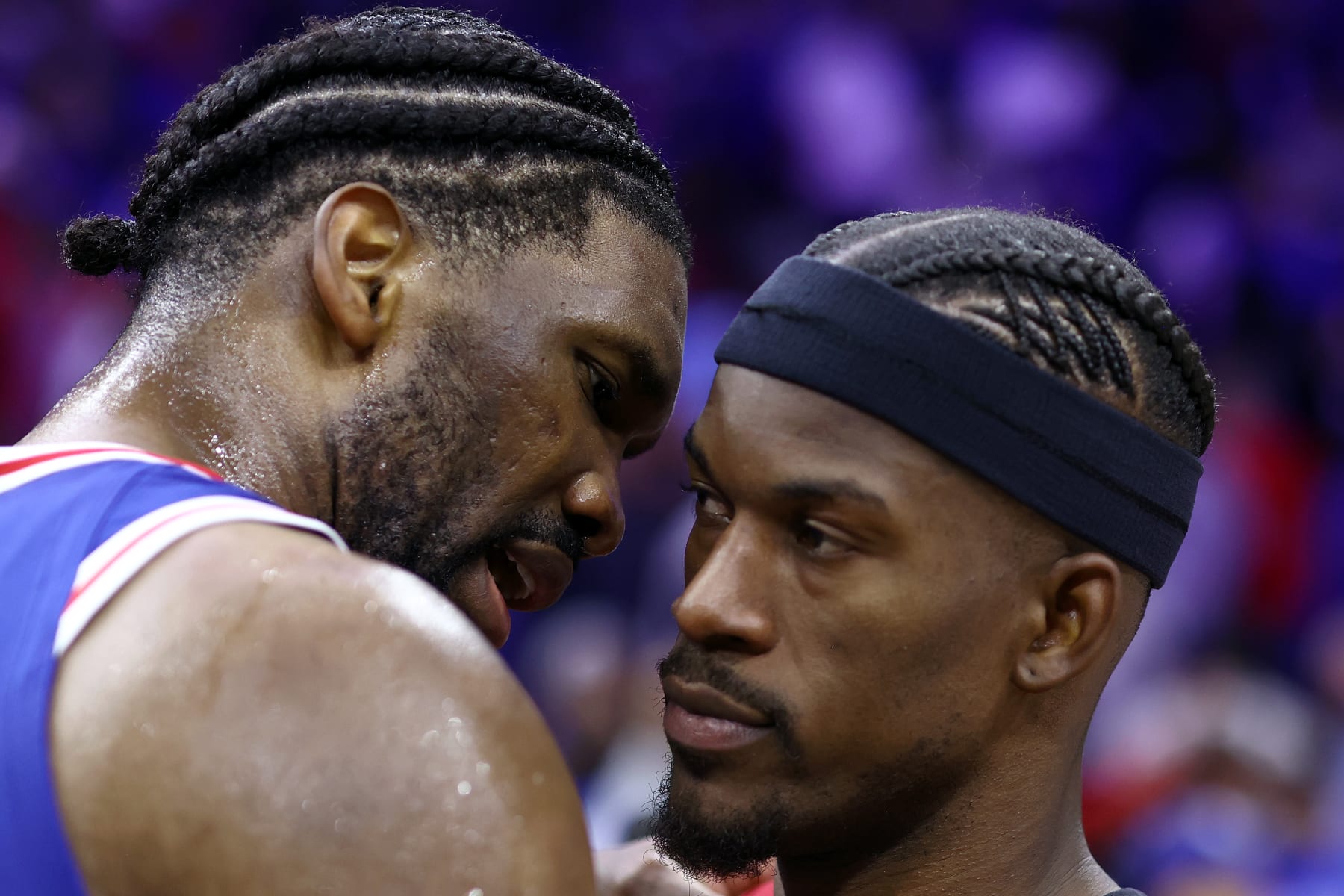 PHILADELPHIA, PENNSYLVANIA - APRIL 17: Joel Embiid #21 of the Philadelphia 76ers speaks to Jimmy Butler #22 of the Miami Heat after the Philadelphia 76ers defeat the Miami Heat in the Eastern Conference Play-In Tournament at the Wells Fargo Center on April 17, 2024 in Philadelphia, Pennsylvania. NOTE TO USER: User expressly acknowledges and agrees that, by downloading and or using this photograph, User is consenting to the terms and conditions of the Getty Images License Agreement. (Photo by Tim Nwachukwu/Getty Images)