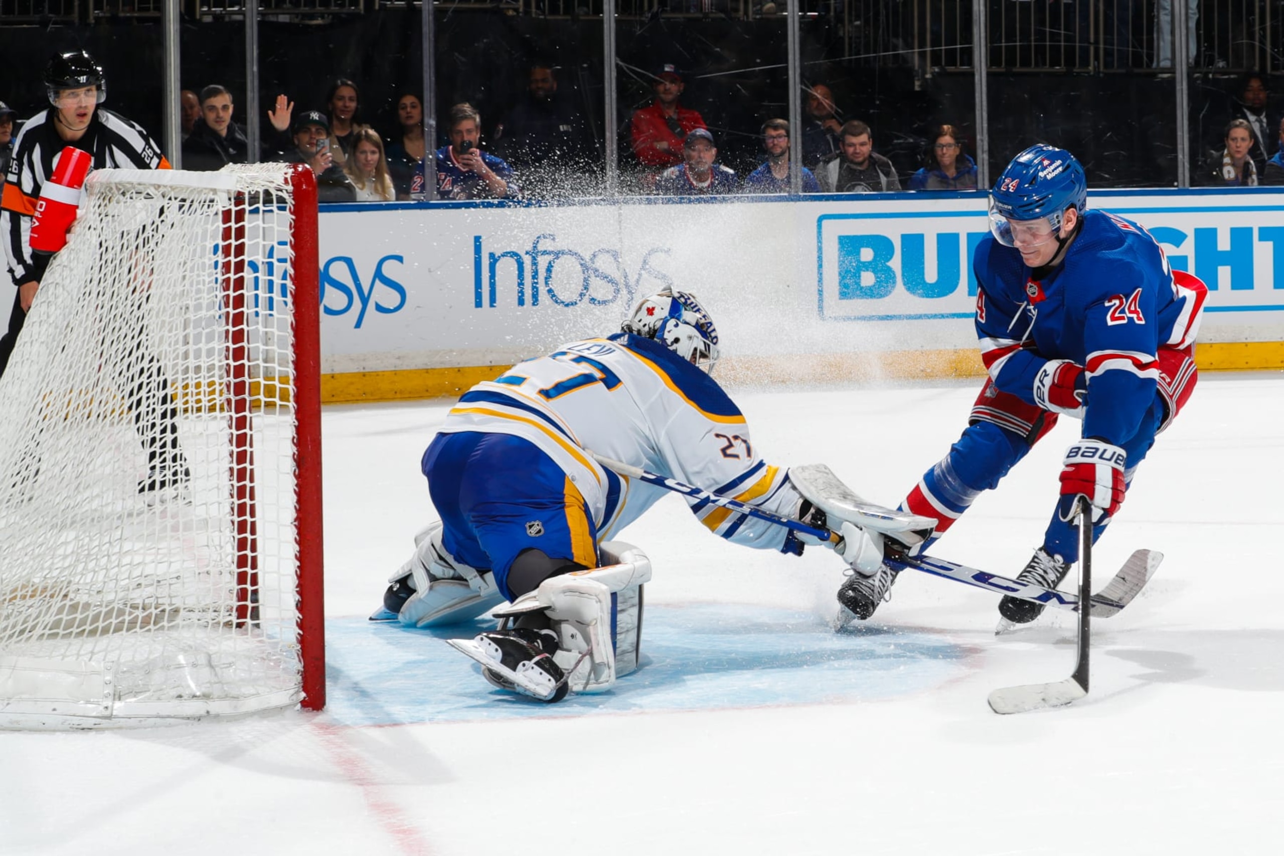 NEW YORK, NEW YORK - APRIL 10:  Devon Levi #27 of the Buffalo Sabres makes a save against Kaapo Kakko #24 of the New York Rangers  to win in the shootout at Madison Square Garden on April 10, 2023 in New York City. (Photo by Jared Silber/NHLI via Getty Images)
