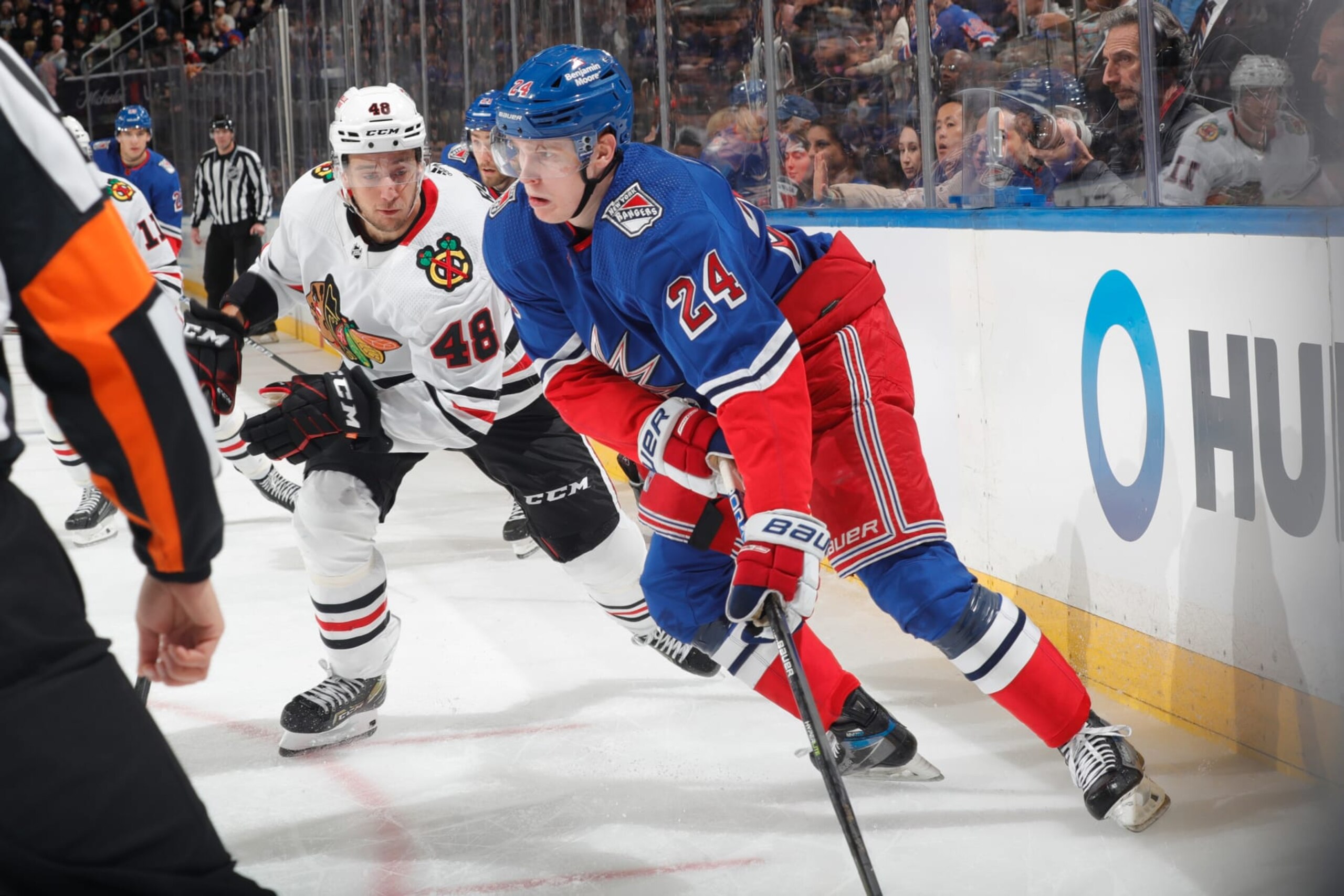 NEW YORK, NEW YORK - DECEMBER 03:  Kaapo Kakko #24 of the New York Rangers skates with the puck against Filip Roos #48 of the Chicago Blackhawks at Madison Square Garden on December 3, 2022 in New York City. (Photo by Jared Silber/NHLI via Getty Images)