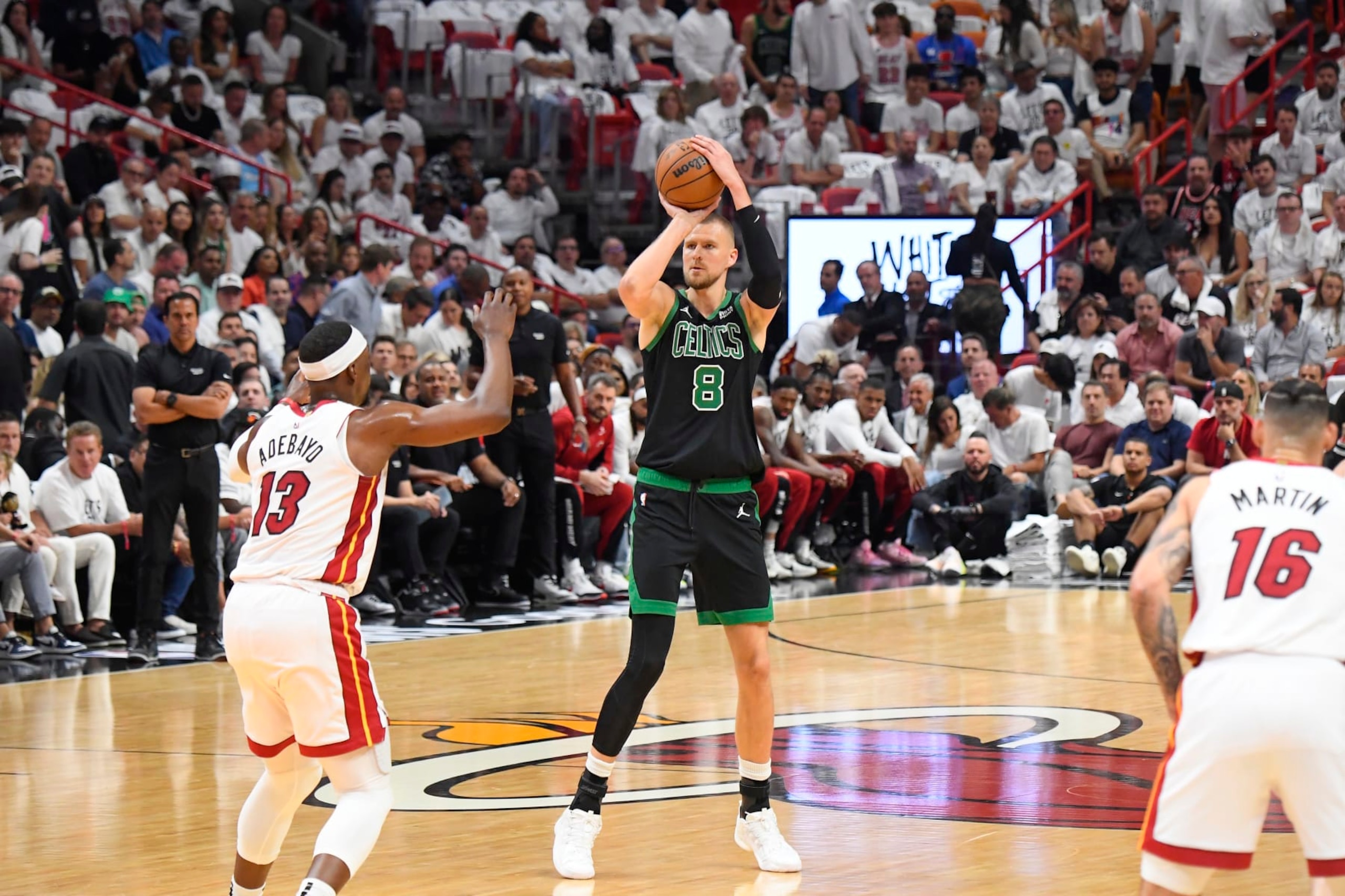 MIAMI, FL - APRIL 29: Kristaps Porzingis #8 of the Boston Celtics shoots a 3-point basket during the game against the Miami Heat during Round 1 Game 4 of the 2024 NBA Playoffs on April 29, 2024 at Kaseya Center in Miami, Florida. NOTE TO USER: User expressly acknowledges and agrees that, by downloading and or using this Photograph, user is consenting to the terms and conditions of the Getty Images License Agreement. Mandatory Copyright Notice: Copyright 2024 NBAE (Photo by Brian Babineau/NBAE via Getty Images) MIAMI, FL - APRIL 29: Kristaps Porzingis #8 of the Boston Celtics shoots a 3-point basket during the game against the Miami Heat during Round 1 Game 4 of the 2024 NBA Playoffs on April 29, 2024 at Kaseya Center in Miami, Florida. NOTE TO USER: User expressly acknowledges and agrees that, by downloading and or using this Photograph, user is consenting to the terms and conditions of the Getty Images License Agreement. Mandatory Copyright Notice: Copyright 2024 NBAE (Photo by Brian Babineau/NBAE via Getty Images)