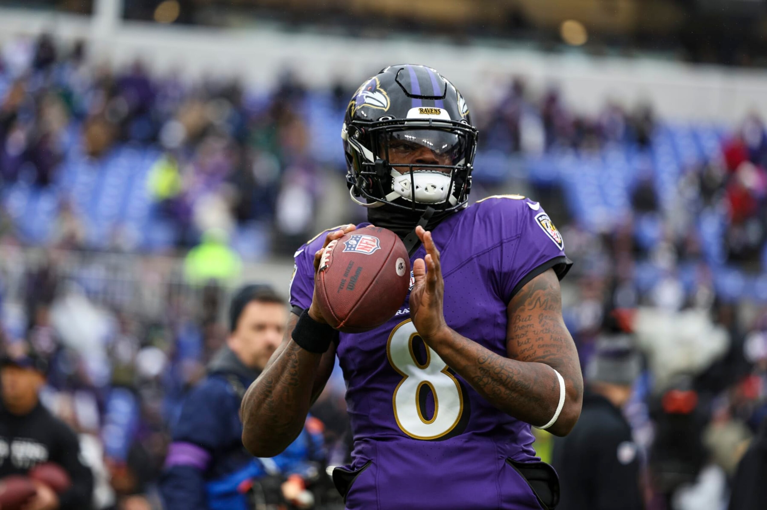 BALTIMORE, MD - JANUARY 28: Lamar Jackson #8 of the Baltimore Ravens warms up prior to the AFC Championship NFL football game against the Kansas City Chiefs at M&T Bank Stadium on January 28, 2024 in Baltimore, Maryland. (Photo by Perry Knotts/Getty Images)