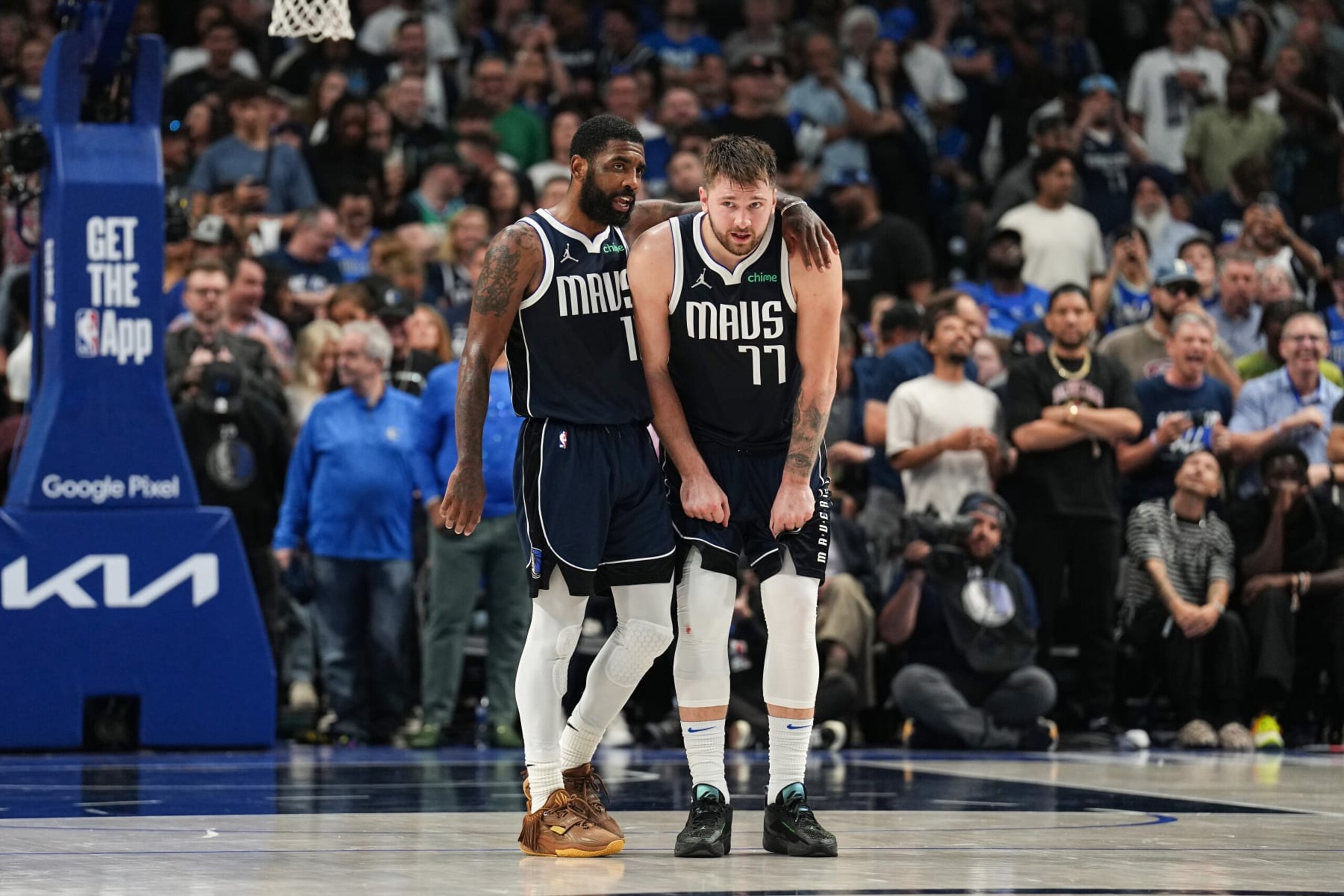 DALLAS, TX - MAY 26: Kyrie Irving #11 embraces Luka Doncic #77 of the Dallas Mavericks during the game against the Minnesota Timberwolves during Game 3 of the Western Conference Finals of the 2024 NBA Playoffs on May 26, 2024 at the American Airlines Center in Dallas, Texas. NOTE TO USER: User expressly acknowledges and agrees that, by downloading and or using this photograph, User is consenting to the terms and conditions of the Getty Images License Agreement. Mandatory Copyright Notice: Copyright 2024 NBAE (Photo by Glenn James/NBAE via Getty Images)