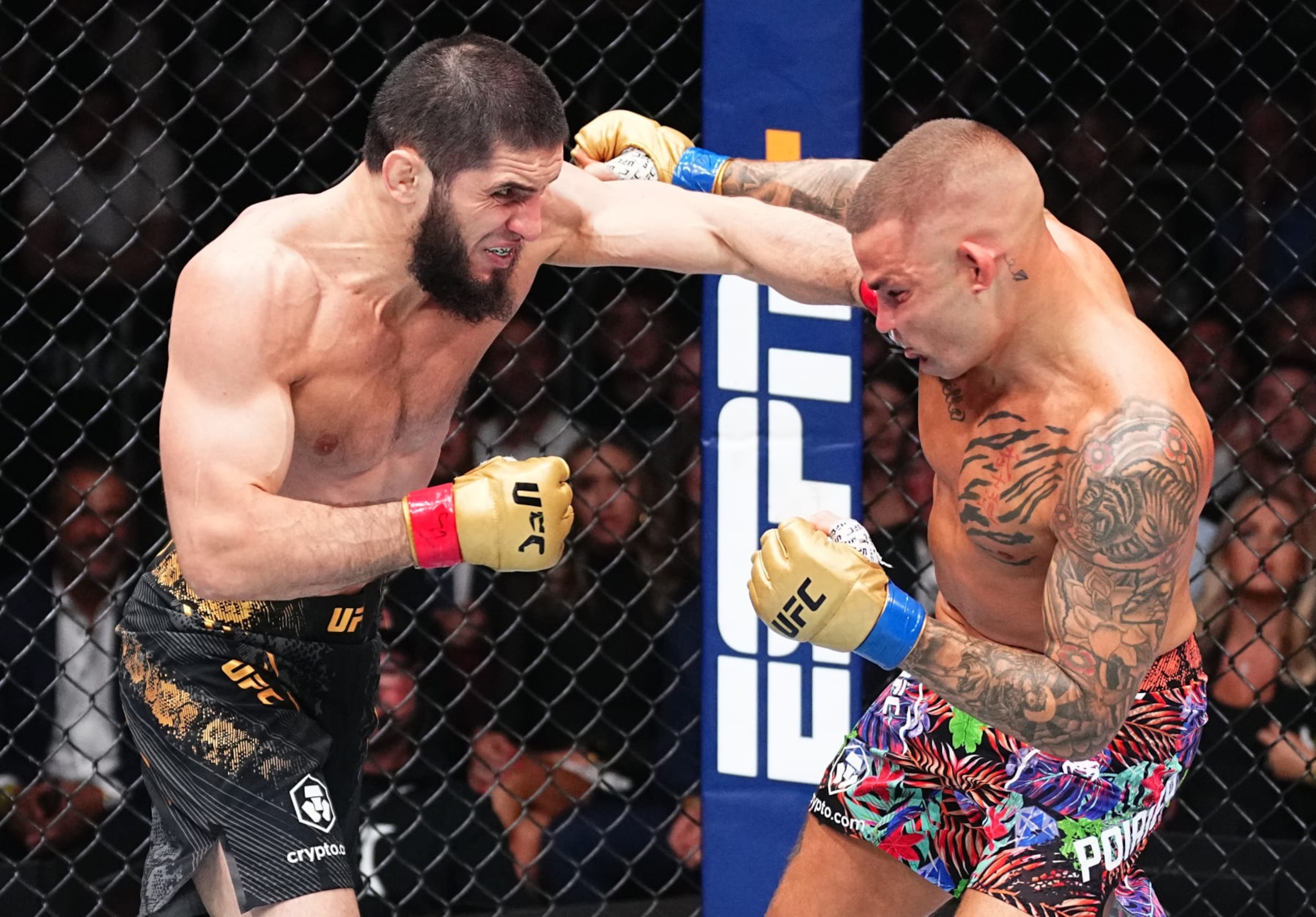 NEWARK, NEW JERSEY - JUNE 01: (L-R) Islam Makhachev of Russia punches Dustin Poirier in the UFC lightweight championship fight during the UFC 302 event at Prudential Center on June 01, 2024 in Newark, New Jersey. (Photo by Jeff Bottari/Zuffa LLC via Getty Images) NEWARK, NEW JERSEY - JUNE 01: (L-R) Islam Makhachev of Russia punches Dustin Poirier in the UFC lightweight championship fight during the UFC 302 event at Prudential Center on June 01, 2024 in Newark, New Jersey. (Photo by Jeff Bottari/Zuffa LLC via Getty Images)