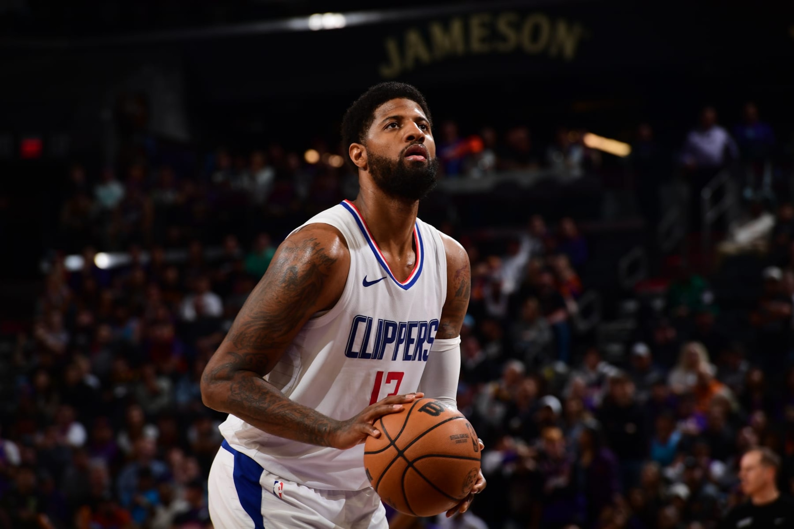 PHOENIX, AZ - APRIL  9: Paul George #13 of the LA Clippers shoots a free throw during the game against the Phoenix Suns on April 9, 2024 at Footprint Center in Phoenix, Arizona. NOTE TO USER: User expressly acknowledges and agrees that, by downloading and or using this photograph, user is consenting to the terms and conditions of the Getty Images License Agreement. Mandatory Copyright Notice: Copyright 2024 NBAE (Photo by Kate Frese/NBAE via Getty Images)