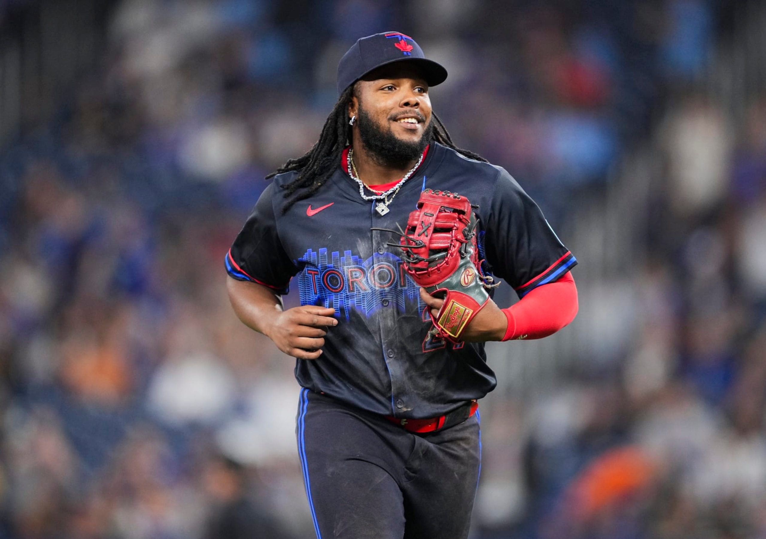 TORONTO, ON - MAY 31: Vladimir Guerrero Jr. #27 of Toronto Blue Jays smiles as he comes off the field against the Pittsburgh Pirates during the fourteenth inning in their MLB game at the Rogers Centre on May 31, 2024 in Toronto, Ontario, Canada. (Photo by Mark Blinch/Getty Images)