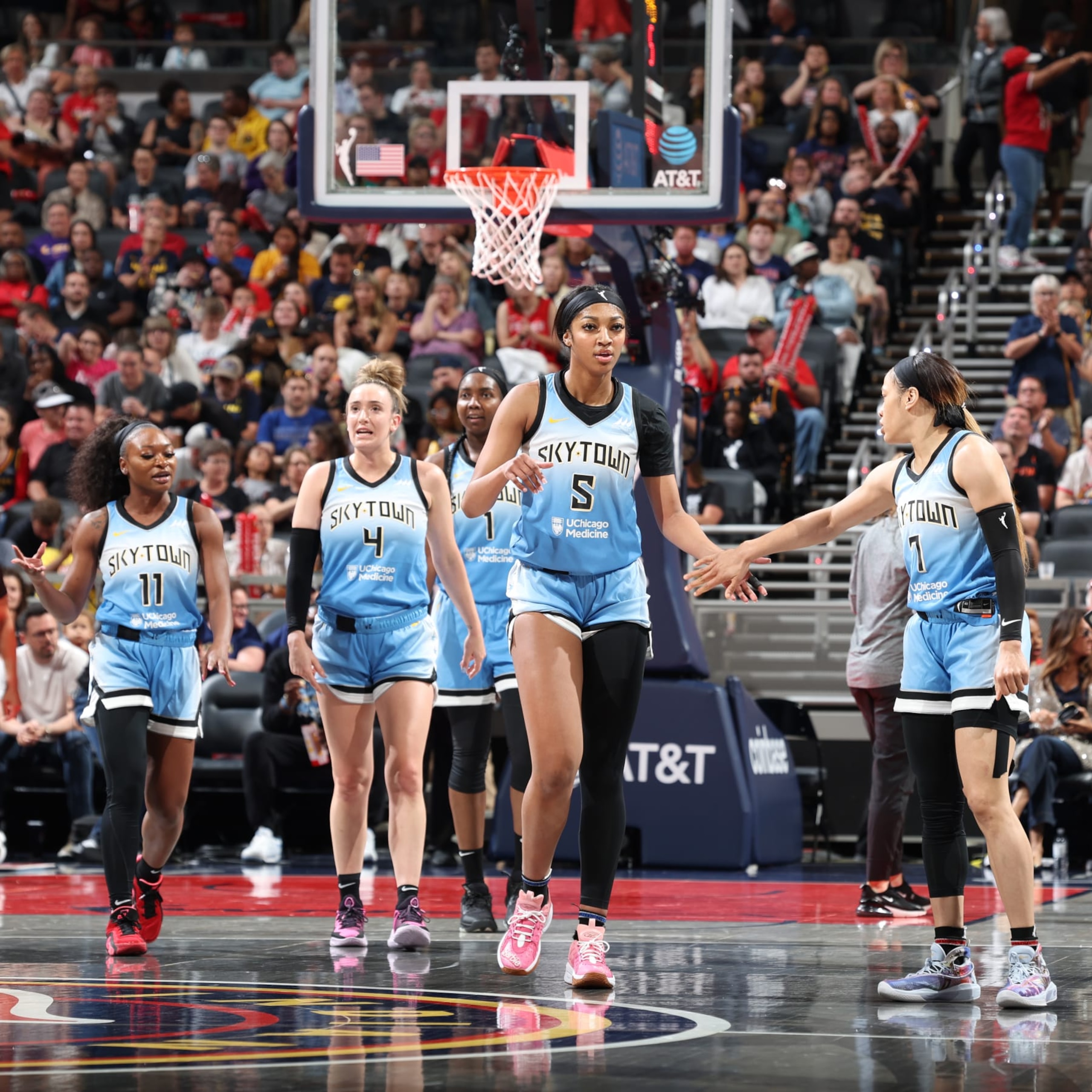 INDIANAPOLIS, IN - JUNE 1: Angel Reese #5 and Chennedy Carter #7 of the Chicago Sky high five during the game against the Indiana Fever against the Indiana Fever on June 1, 2024 at Gainbridge Fieldhouse in Indianapolis, Indiana. NOTE TO USER: User expressly acknowledges and agrees that, by downloading and or using this Photograph, user is consenting to the terms and conditions of the Getty Images License Agreement. Mandatory Copyright Notice: Copyright 2024 NBAE (Photo by Jeff Haynes/NBAE via Getty Images)