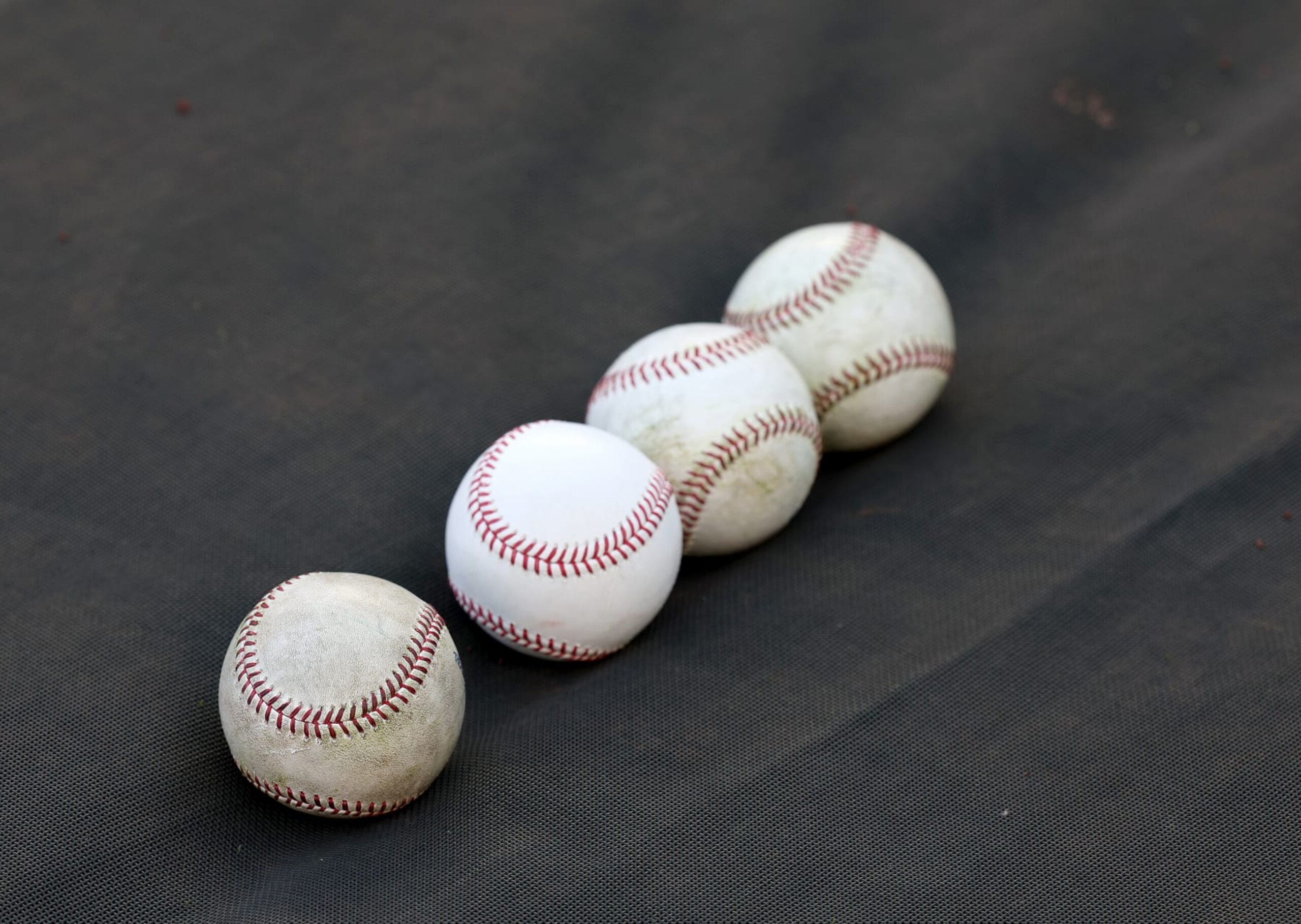 BRONX, NEW YORK - APRIL 13: Baseballs are seen on the tarp during batting practice before the game between the New York Yankees and the Minnesota Twins at Yankee Stadium on April 13, 2023 in Bronx borough of New York City. (Photo by Elsa/Getty Images)