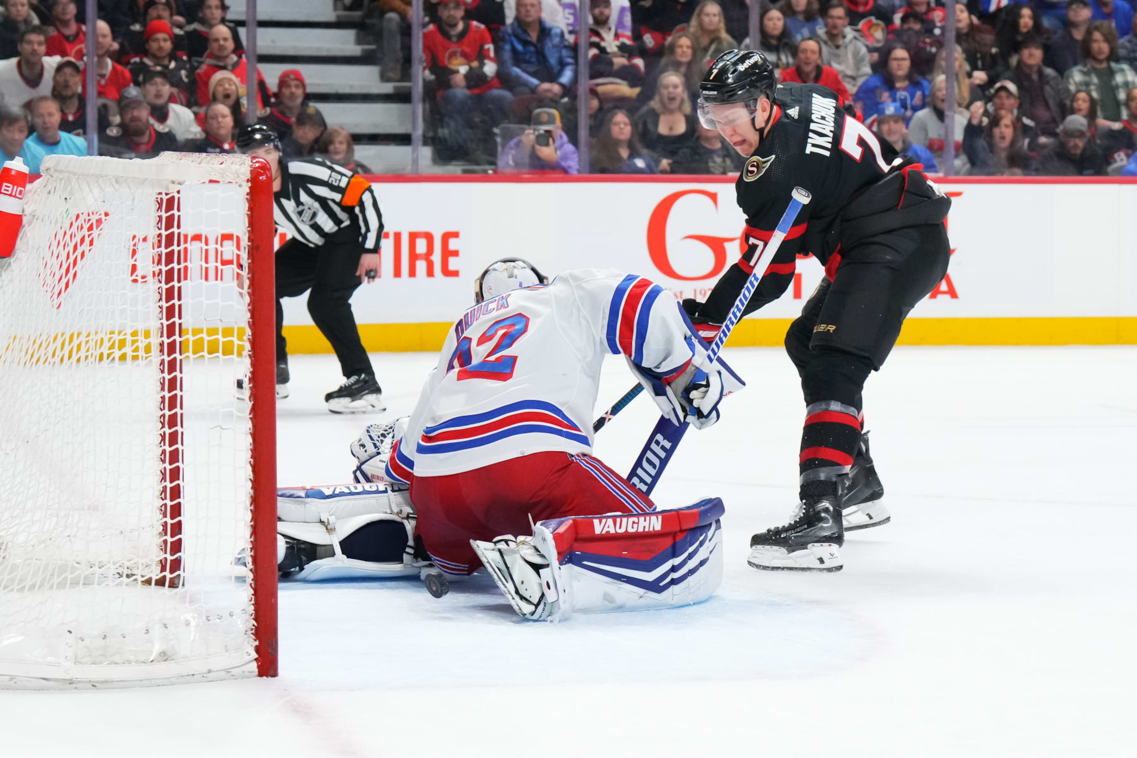 OTTAWA, CANADA - JANUARY 27:  Brady Tkachuk #7 of the Ottawa Senators backhands the puck under Jonathan Quick #32 of the New York Rangers, scoring a first period goal at Canadian Tire Centre on January 27, 2024 in Ottawa, Ontario, Canada.  (Photo by André Ringuette/NHLI via Getty Images)