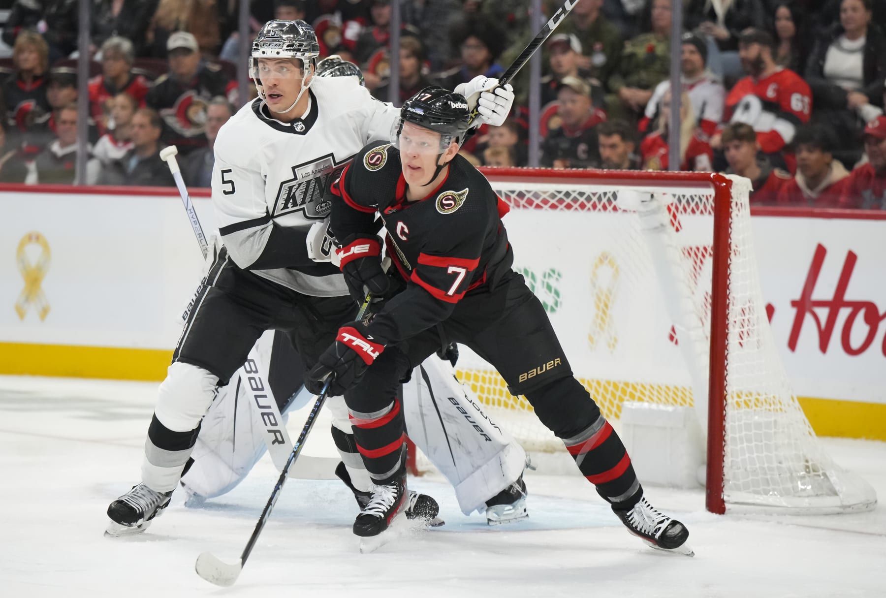 OTTAWA, CANADA - NOVEMBER 2: Brady Tkachuk #7 of the Ottawa Senators battles for position against Andreas Englund #5 of the Los Angeles Kings at Canadian Tire Centre on November 2, 2023 in Ottawa, Ontario, Canada.  (Photo by André Ringuette/NHLI via Getty Images)