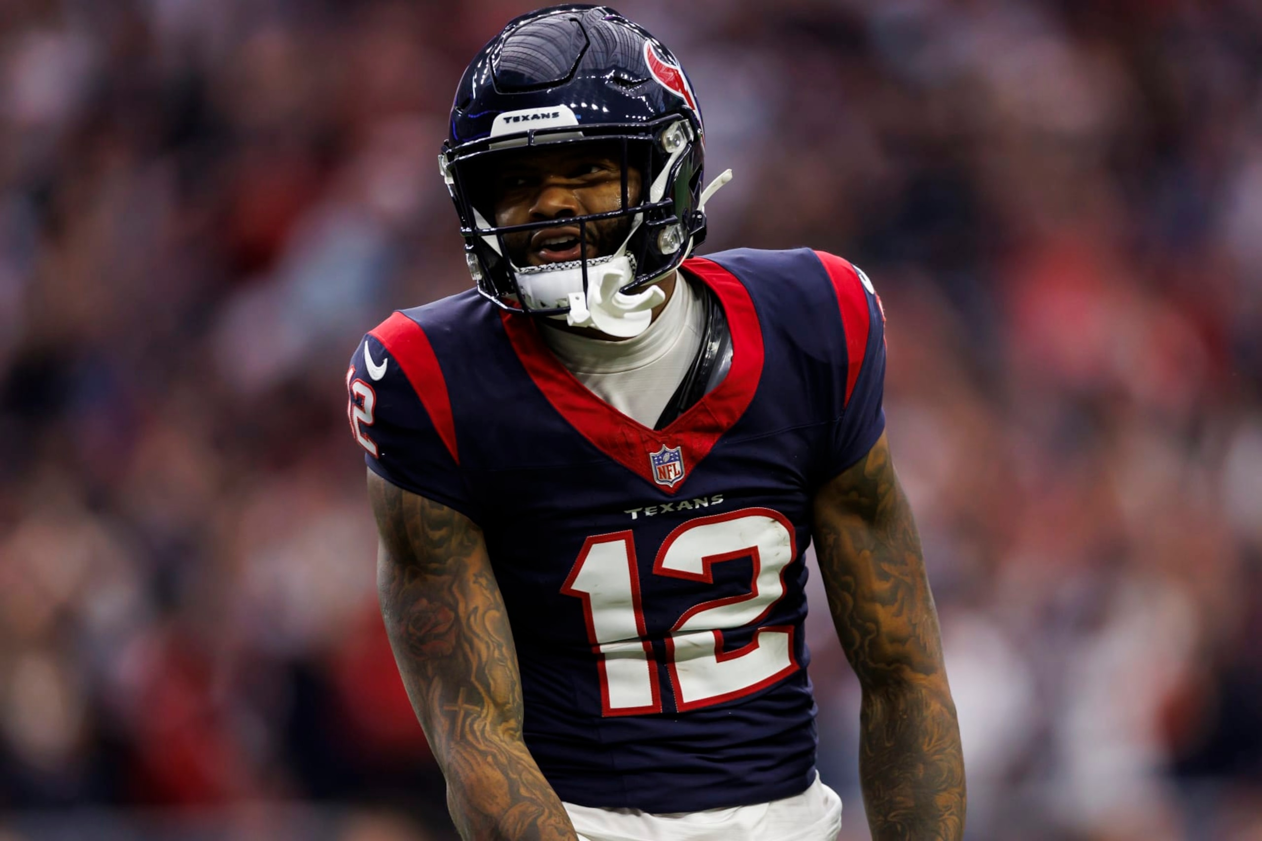 HOUSTON, TEXAS - JANUARY 13: Nico Collins #12 of the Houston Texans celebrates after a catch during an AFC wild-card playoff football game against the Cleveland Browns at NRG Stadium on January 13, 2024 in Houston, Texas. (Photo by Ryan Kang/Getty Images)