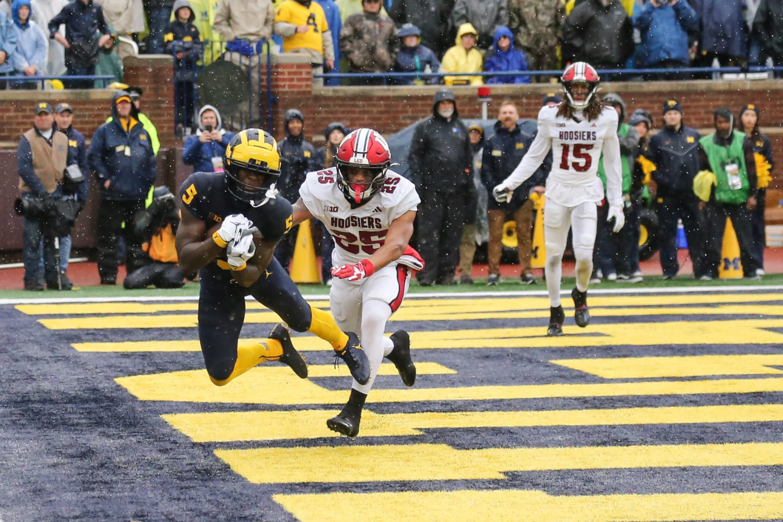 ANN ARBOR, MI - OCTOBER 14:  Michigan Wolverines wide receiver Karmello English (5) catches a pass in the end zone for a touchdown against Indiana Hoosiers defensive back Amare Ferrell (25) during a Big Ten Conference college football game between the Indiana Hoosiers and the Michigan Wolverines on October 14, 2023 at Michigan Stadium in Ann Arbor, Michigan.  (Photo by Scott W. Grau/Icon Sportswire via Getty Images)