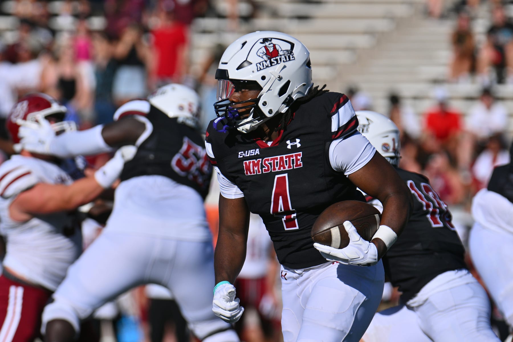 LAS CRUCES, NEW MEXICO - AUGUST 26: Star Thomas #4 of the New Mexico State Aggies runs for yardage against the Massachusetts Minutemen during the first half of their game at Aggie Memorial Stadium on August 26, 2023 in Las Cruces, New Mexico. (Photo by Sam Wasson/Getty Images)