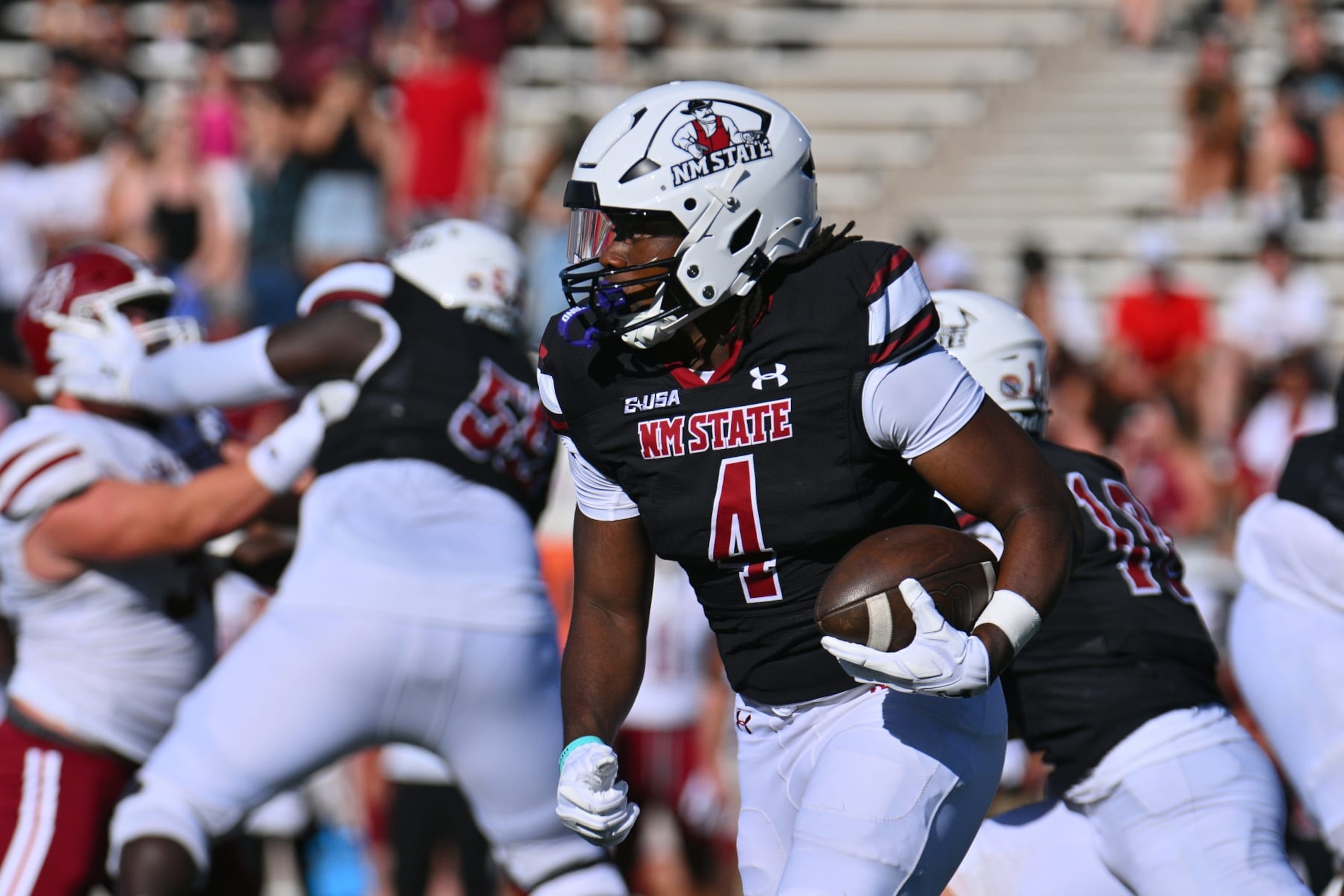 LAS CRUCES, NEW MEXICO - AUGUST 26: Star Thomas #4 of the New Mexico State Aggies runs for yardage against the Massachusetts Minutemen during the first half of their game at Aggie Memorial Stadium on August 26, 2023 in Las Cruces, New Mexico. (Photo by Sam Wasson/Getty Images)