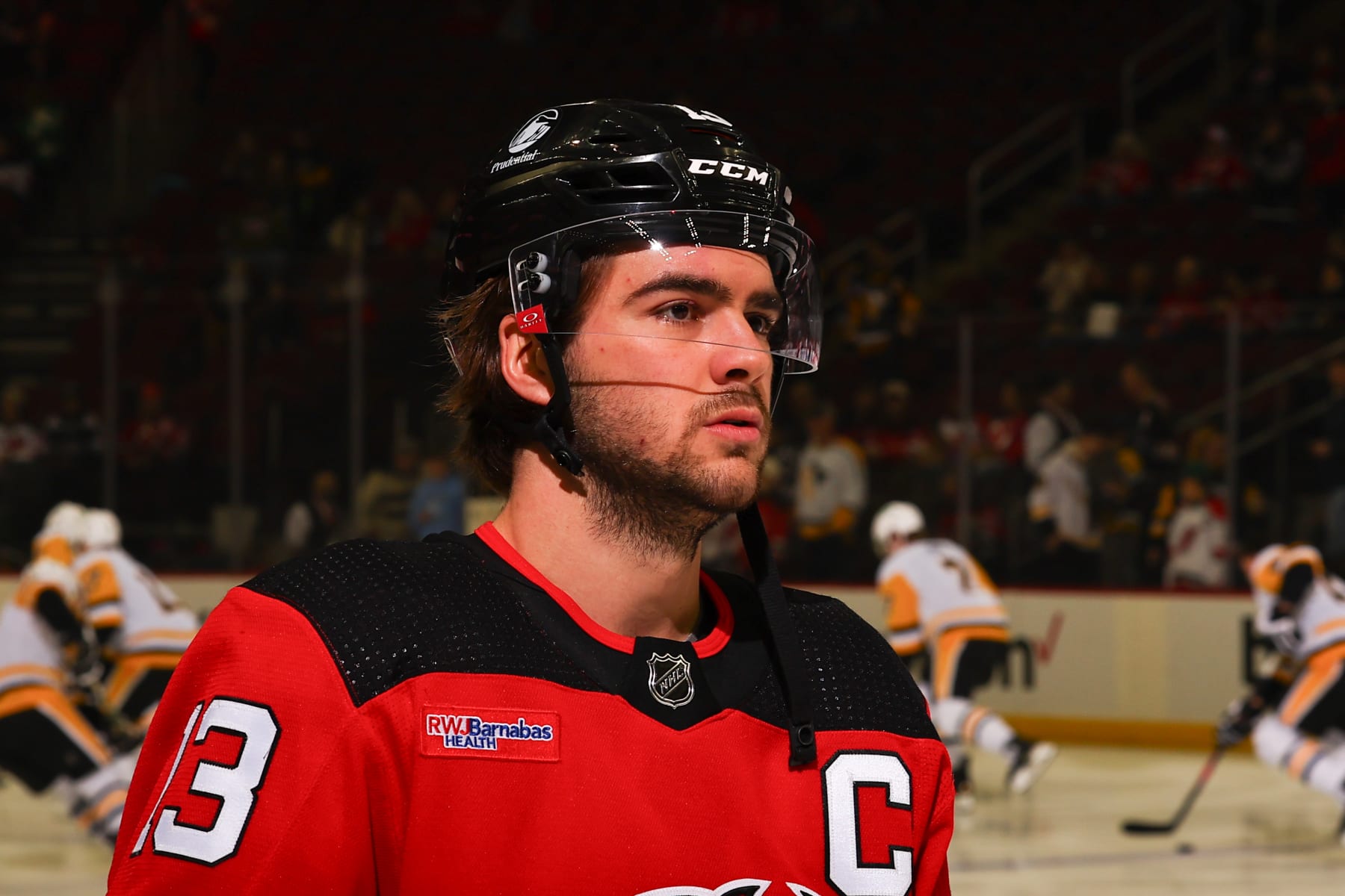 NEWARK, NJ - APRIL 02: Nico Hischier #13 of the New Jersey Devils skates during warm up prior to the game against the Pittsburgh Penguins at the Prudential Center on April 2, 2024 in Newark, New Jersey.  (Photo by Rich Graessle/NHLI via Getty Images)