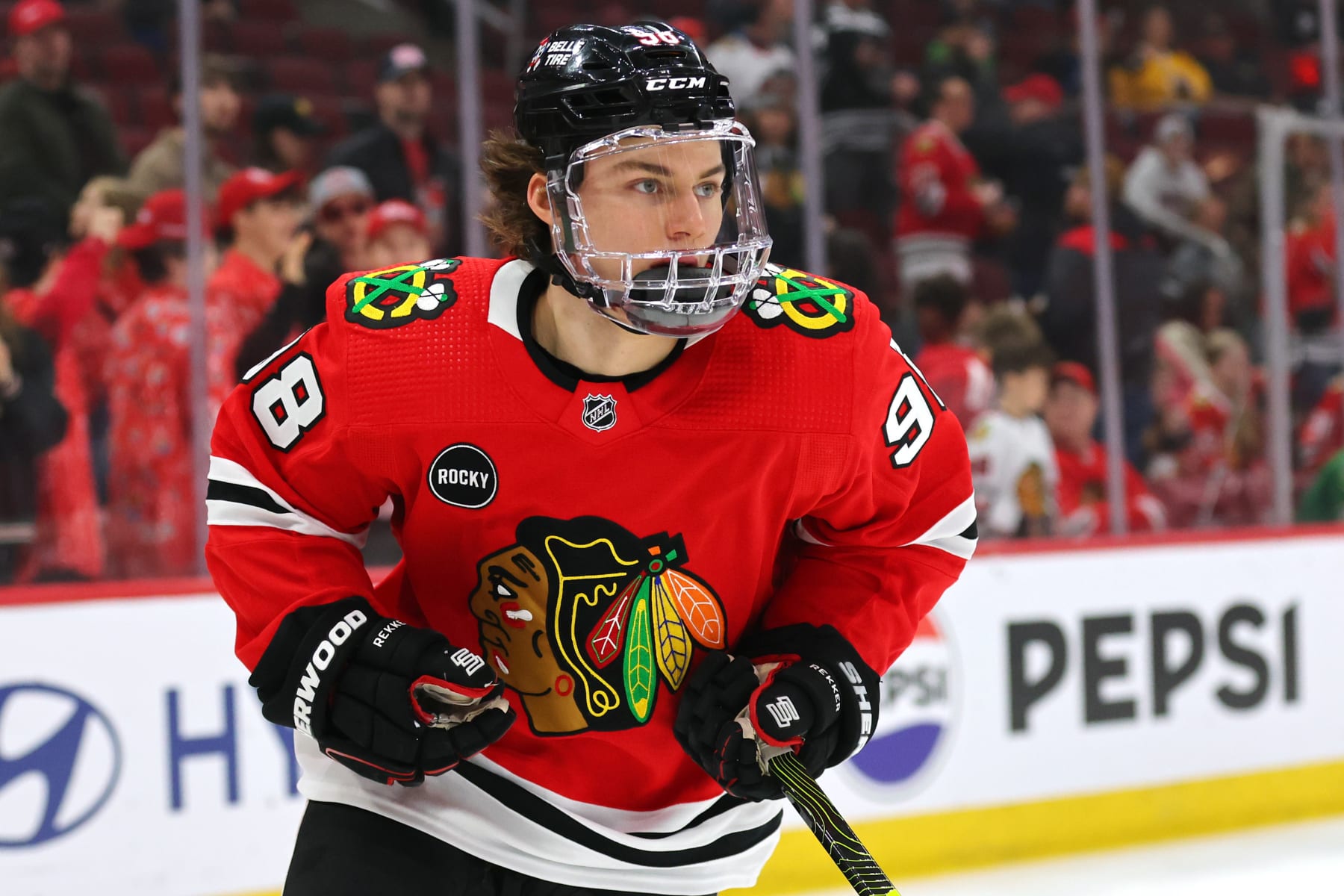 CHICAGO, ILLINOIS - APRIL 12: Connor Bedard #98 of the Chicago Blackhawks looks on prior to the game against the Nashville Predators at the United Center on April 12, 2024 in Chicago, Illinois. (Photo by Michael Reaves/Getty Images)