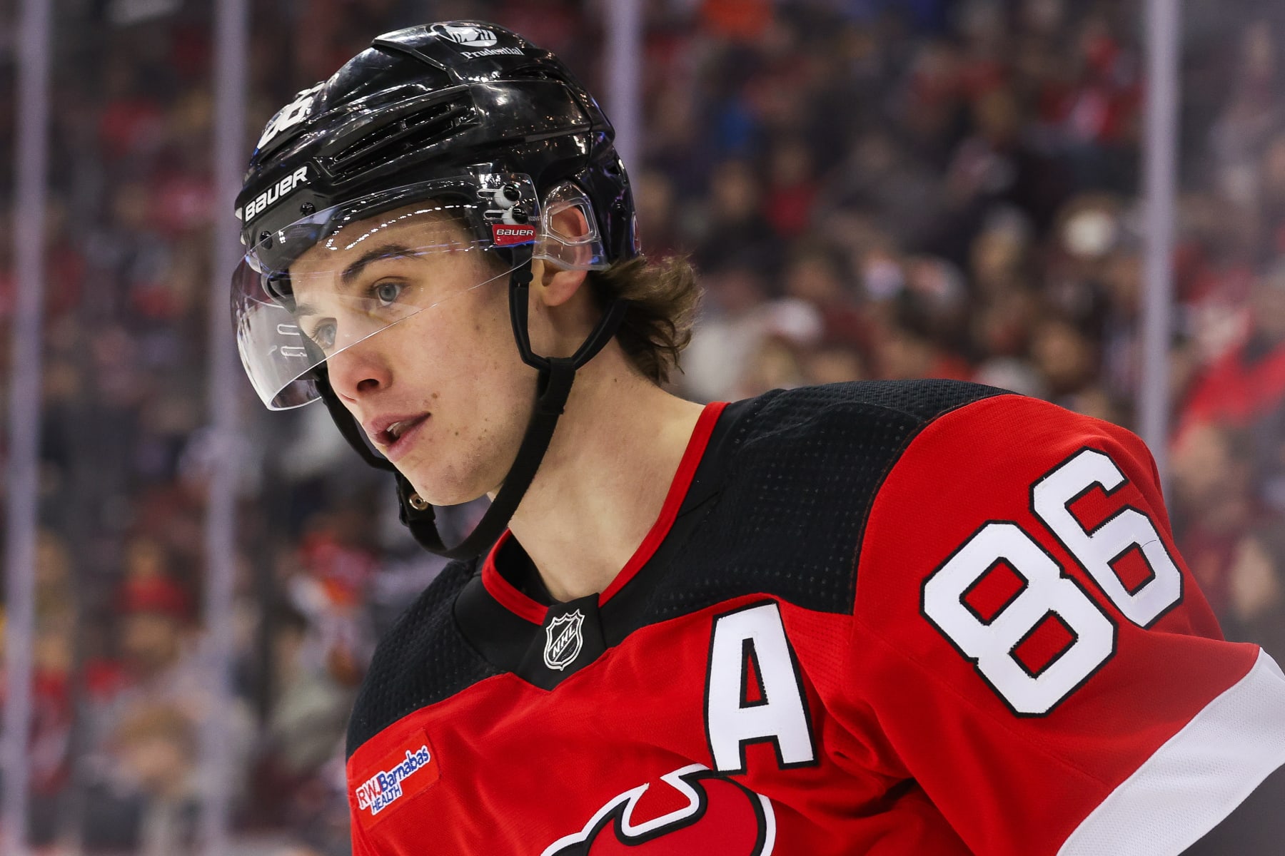 NEWARK, NJ - APRIL 02: New Jersey Devils center Jack Hughes (86) looks on during a game between the Pittsburgh Penguins and New Jersey Devils on April 2, 2024 at Prudential Center in the Newark, New Jersey. (Photo by Andrew Mordzynski/Icon Sportswire via Getty Images)