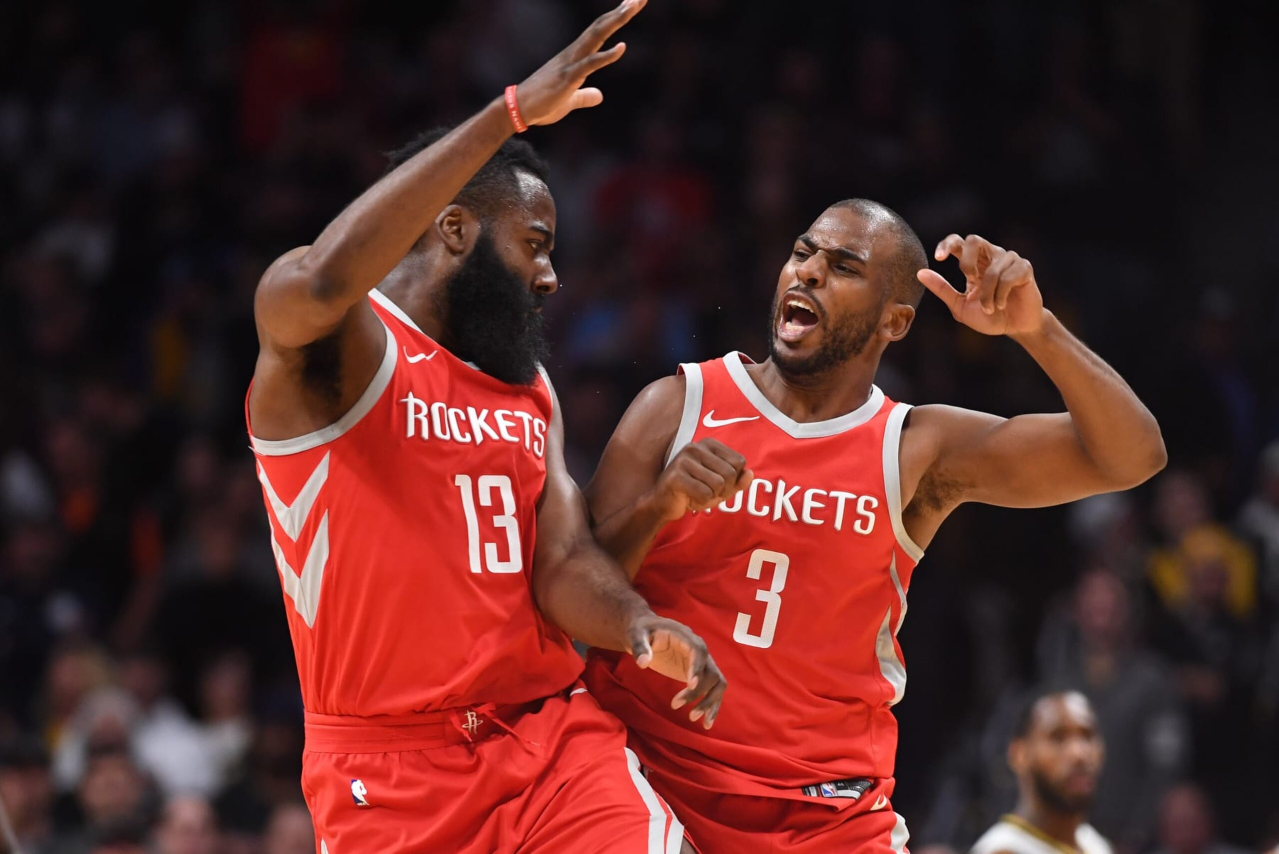 DENVER, CO - FEBRUARY 25: James Harden #13 and Chris Paul #3 of the Houston Rockets celebrate during a timeout against the Denver Nuggets at Pepsi Center on February 25, 2018 in Denver, Colorado. NOTE TO USER: User expressly acknowledges and agrees that, by downloading and or using this photograph, User is consenting to the terms and conditions of the Getty Images License Agreement. (Photo by Justin Tafoya/Getty Images)