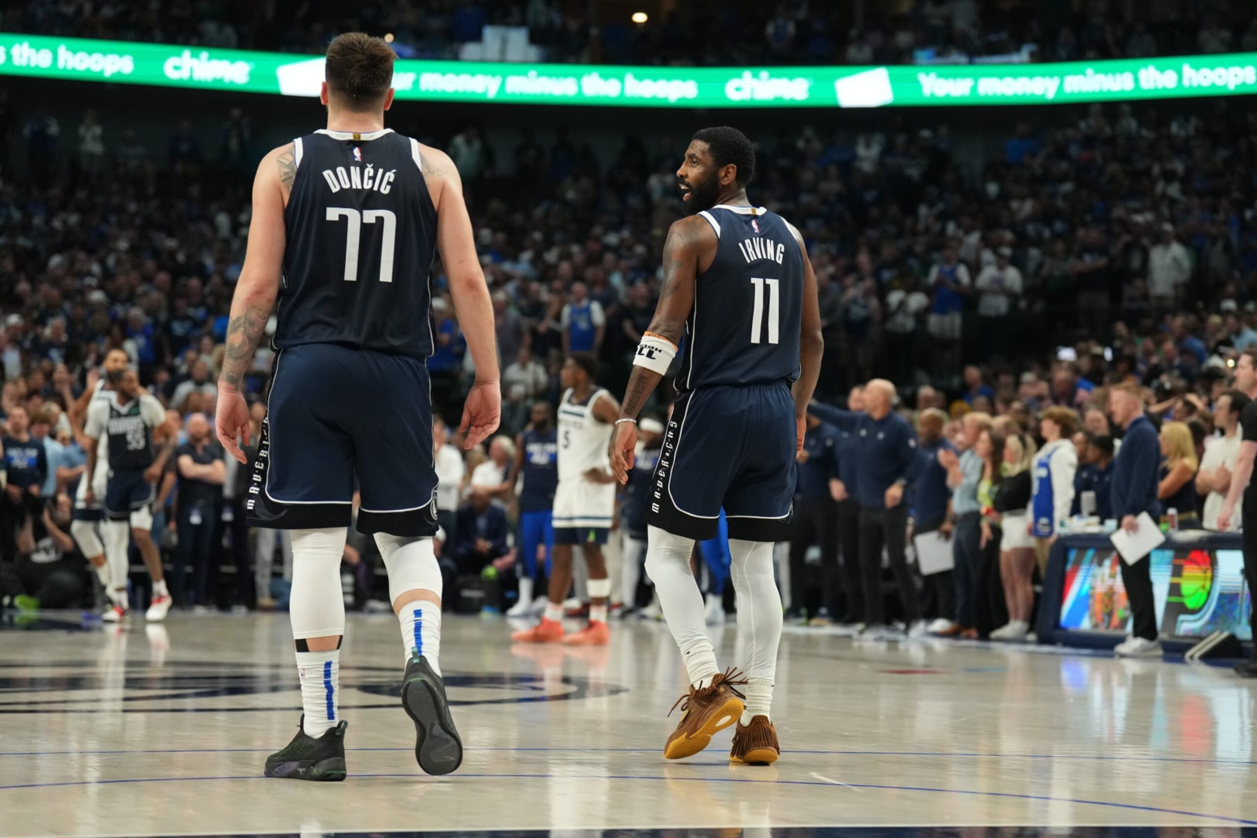 DALLAS, TX - MAY 26: Kyrie Irving #11 and Luka Doncic #77 of the Dallas Mavericks celebrate after the game against the Minnesota Timberwolves during Game 3 of the Western Conference Finals of the 2024 NBA Playoffs on May 26, 2024 at the American Airlines Center in Dallas, Texas. NOTE TO USER: User expressly acknowledges and agrees that, by downloading and or using this photograph, User is consenting to the terms and conditions of the Getty Images License Agreement. Mandatory Copyright Notice: Copyright 2024 NBAE (Photo by Jesse D. Garrabrant/NBAE via Getty Images)