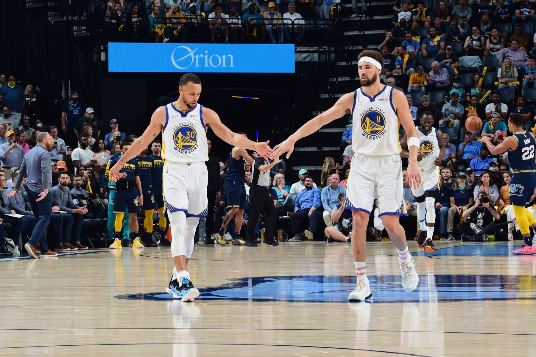 MEMPHIS, TN - MAY 3: Stephen Curry #30 high fives Klay Thompson #11 of the Golden State Warriors during the game against the Memphis Grizzliesduring Game 2 of the 2022 NBA Playoffs Western Conference Semifinals on May 3, 2022 at FedExForum in Memphis, Tennessee. NOTE TO USER: User expressly acknowledges and agrees that, by downloading and or using this photograph, user is consenting to the terms and conditions of Getty Images License Agreement. Mandatory Copyright Notice: Copyright 2022 NBAE (Photo by Noah Graham/NBAE via Getty Images)