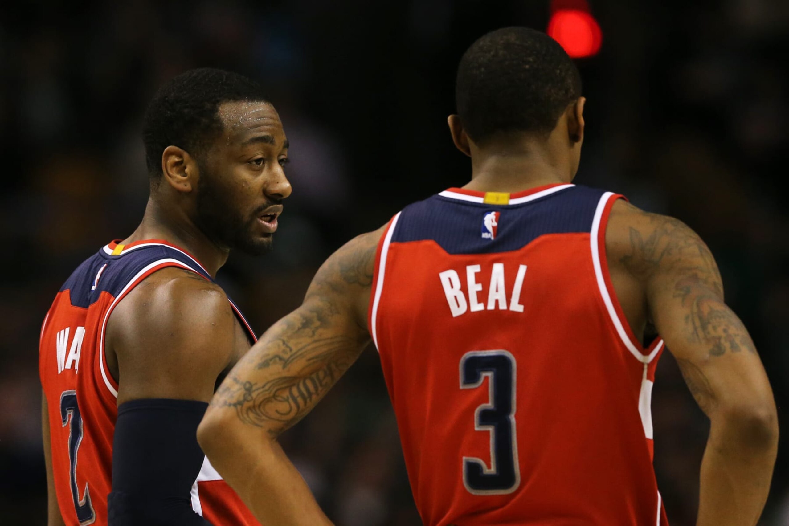 BOSTON, MA - MARCH 20: John Wall #2 of the Washington Wizards and Bradley Beal #3 talk together during the third quarter against the Boston Celtics at TD Garden on March 20, 2017 in Boston, Massachusetts. NOTE TO USER: User expressly acknowledges and agrees that, by downloading and or using this Photograph, user is consenting to the terms and conditions of the Getty Images License Agreement. (Photo by Maddie Meyer/Getty Images)