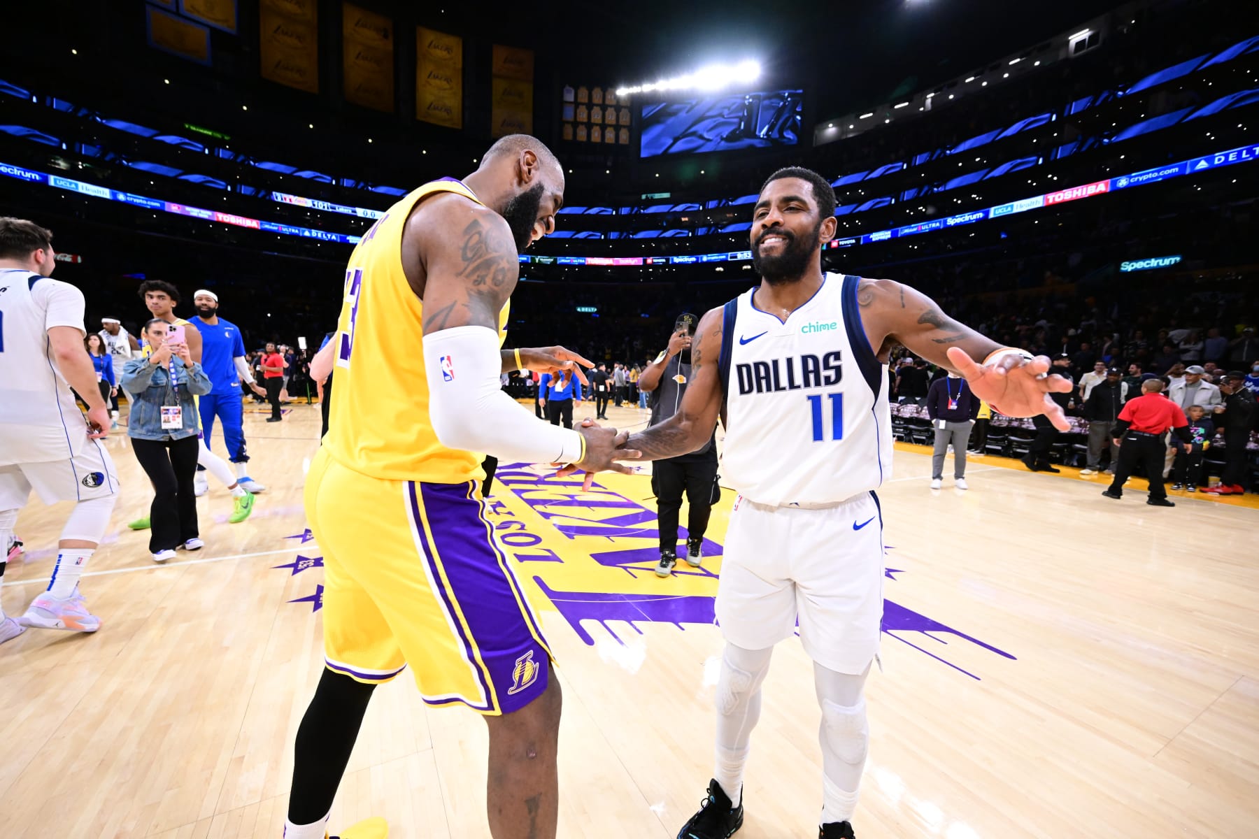LOS ANGELES, CA - NOVEMBER 22: LeBron James #23 of the Los Angeles Lakers embraces Kyrie Irving #11 of the Dallas Mavericks after the game on November 22, 2023 at Crypto.Com Arena in Los Angeles, California. NOTE TO USER: User expressly acknowledges and agrees that, by downloading and/or using this Photograph, user is consenting to the terms and conditions of the Getty Images License Agreement. Mandatory Copyright Notice: Copyright 2023 NBAE (Photo by Adam Pantozzi/NBAE via Getty Images)