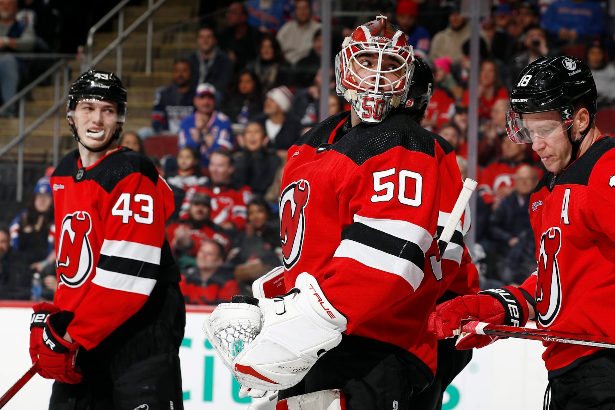 NEWARK, NEW JERSEY - FEBRUARY 22: Nico Daws #50 of the New Jersey Devils reacts after allowing a goal to Alexis Lafreniere #13 of the New York Rangers during the first period at Prudential Center on February 22, 2024 in Newark, New Jersey. (Photo by Sarah Stier/Getty Images)